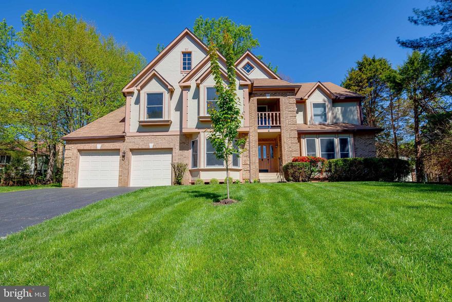 This stunning colonial offers many features to list, an spacious gourmet kitchen with 2 wall ovens, wood cabinets, stainless steel appliances, granite countertops,walk in pantry, bar area, open floor plan, 2 fireplaces . A wooded paneled library with numerous built ins, a living and dining room full of natural light , harwood floors throughout the main floor . The stunning master suit features a sitting room and a bonus office room with acess to a relaxing balcony , the master bathroom is totally updated with sunlights , sunken tub, separate shower , walking closet with lots of space . The basement features a full bathroom, big entertaiment room, a fireplace and ots of storage space that can be used as a workshop as well . The family room features a fireplace , acess to the spacios deck and fenced backyard . Minutes to Fairfax County Parway,  VRE, bus stop, and metro station .Do not miss it !