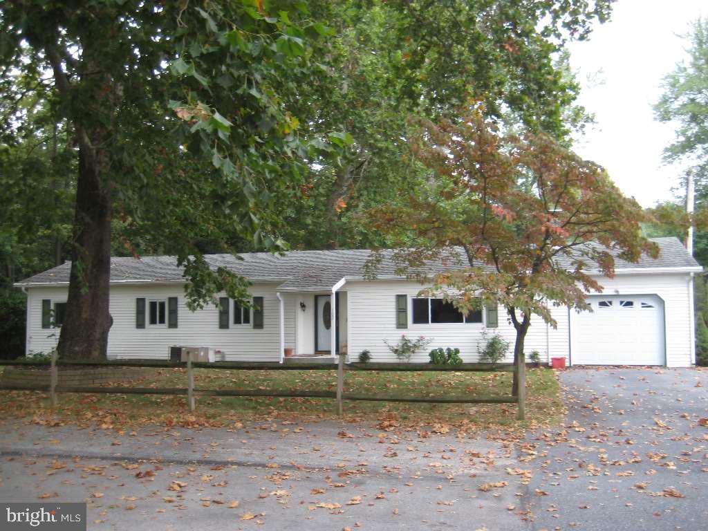 Tranquil setting with mature trees on Mountain Creek. Could be 3 bedrooms by adding a wall. Living room has brick wood burning fireplace. Light filled addition in back with wood stove, covered patio, new windows with life time replacement, one car garage and storage building complete the list of amenities. One of the owners is the listing agent. Home has been a rental, never occupied by seller. Seller to provide carpet in master bedroom.