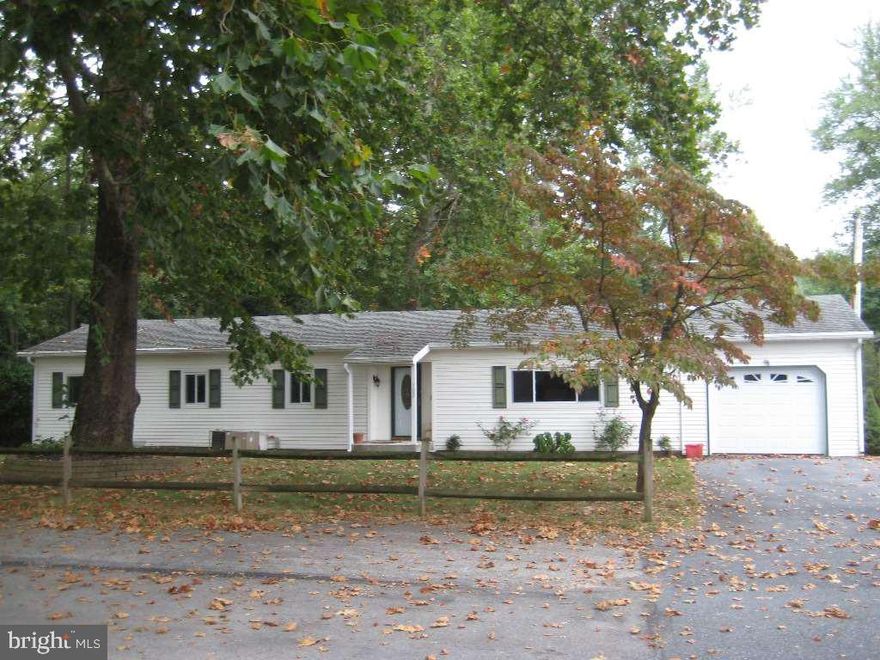 Tranquil setting with mature trees on Mountain Creek. Could be 3 bedrooms by adding a wall. Living room has brick wood burning fireplace. Light filled addition in back with wood stove, covered patio, new windows with life time replacement, one car garage and storage building complete the list of amenities. One of the owners is the listing agent. Home has been a rental, never occupied by seller. Seller to provide carpet in master bedroom.