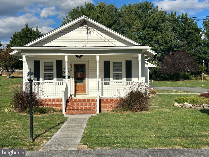 This charming 3 bed, 1 bath 1930's bungalow offers spacious one-level living and is full of potential- ready for your personal touch!  Classic features include well-preserved hardwood floors hidden beneath carpet in living, dining, and bedrooms.  A standout feature is the extra large family room with elegant french doors, perfect for relaxing or entertaining.  Step outside to enjoy a large rear porch, lush landscapes and fish pond - your own private retreat.  Additional highlights include a one car detached garage situated on a large level lot nestled in an established neighborhood just minutes walk from downtown Berryville.  A true gem with vintage charm and room to make it your own.  New roof, updated electric, and windows a few years young.
"Professional photos to come**