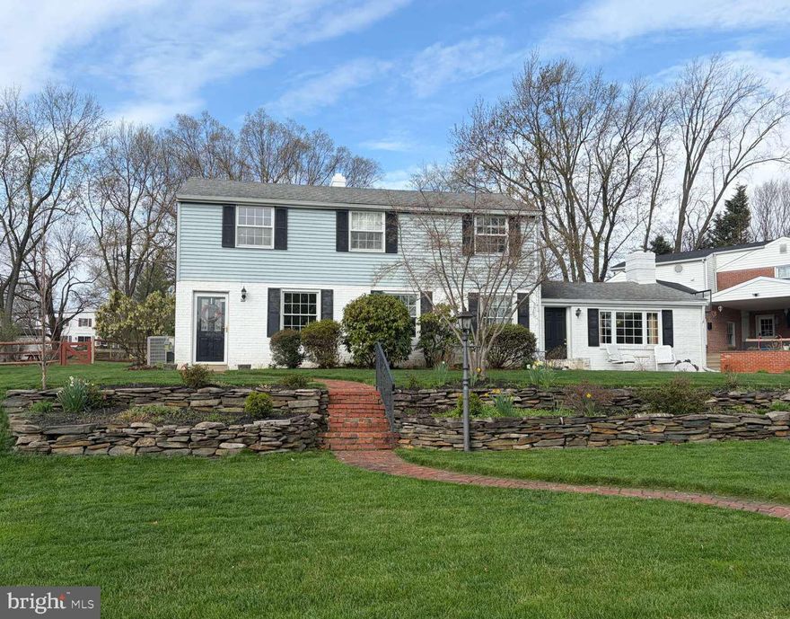 Loved and cared for by four generations of one family, 3169 Mayflower Rd is now ready for new adventures. Located in a highly sought after development and within the boundaries of the highly ranked Colonial School District, this property provides plenty of room to grow and entertain. Sitting on .46 acres, this property welcomes you with a two-tiered hardscaped front garden with a brick walkway to its front door. Enter into a sizable living room with original hardwood floors, wood burning fireplace and open flow to the original dining area. Large windows provide ample natural light and views of the neighborhood island out front that is a meeting place for activities. The kitchen offers abundant counter space for prepping meals or spreading out buffet-style, plenty of cabinet storage space and a pass-through into counter seating in the den. The den, always a visitors favorite, is saturated in natural wood; wood floors, wood ceiling, storage bench and trim. The brick wood burning fireplace is the focal point with large windows on either side to soak the room in sunlight. From the kitchen you step up into the back open concept dining area and great room that accommodates large gatherings for holiday celebrations, summer parties or movie nights. Flanked with windows and doors on every exterior wall, this room soaks in the light and provides views of the large fenced in backyard. Laundry, a powder room and utilities finish the first floor. Upstairs are five well-proportioned bedrooms, two full baths, ample storage with 10 closets (one of which is a very large walk-in cedar closet) and access to attic storage.The expansive, fully fenced backyard is an extension of the home’s hospitality. It features a storage shed, lush gardens, and a unique piece of history: an "old-school" brick fireplace grill hand-built by the family’s great-grandfather. Whether you are hosting sports in the open green space or relaxing in the shade, this yard is a true sanctuary. Properties like this don't come onto the market often, schedule your tour today. Property is Sold As-is, where-is.