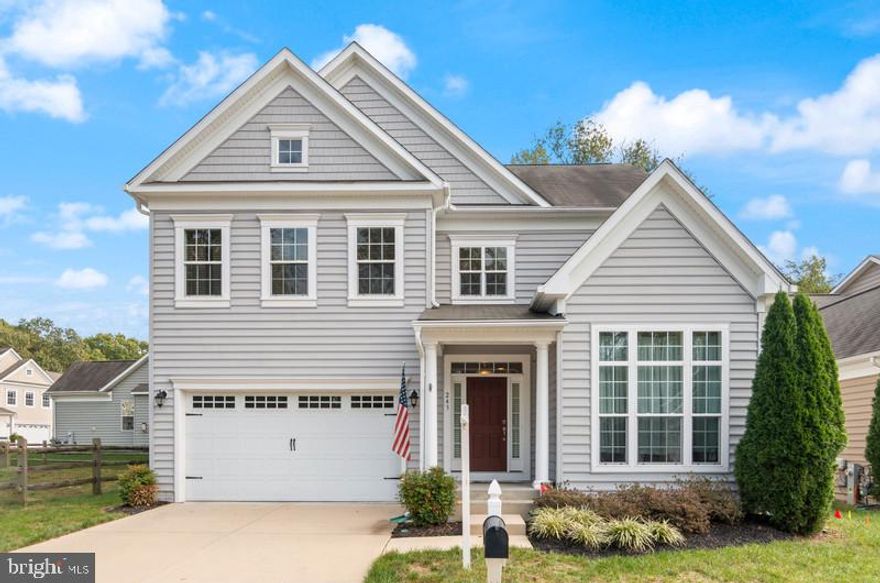 Welcome Home to this Lovely  Water view Colonial in the Sought after Gated Community of Creekside at Osprey Landing. 4 Bedrooms and 3.5 Baths, Enter to a Large Hardwood Livingroom ,Formal Dining Room, A Chefs Dream Gourmet Kitchen, with Island ,Custom 42 inch Cabinets, Double Ovens and Stainless Steel Appliances, Main level Office /Study, and Large Family room all with  9 Foot Ceilings. Main Level Powder Room, The Upper Level features 4 Bedrooms, a Large Master Suite and Master Bath with Soaker Tub, Double Vanities ,Large Custom Shower and Tile Floors. Large Lower Level Walkout Basement Recreation Room with Custom Tile Flooring ,Full Bathroom ,Work shop and ample Storage. Private backyard with Maintenance Free Deck for Relaxing and Entertaining. All just steps away from the Lavish Clubhouse with Gymnasium ,Marina on Marley Creek where a Conveying Boat Slip awaits with  6.5 foot Mean Low Water. This Home is a Pleasure to Show. Bring your Pickiest Buyers. Close to Schools, Shopping Restaurants, Great Commute to Baltimore, Fort Meade NSA and Washington DC.