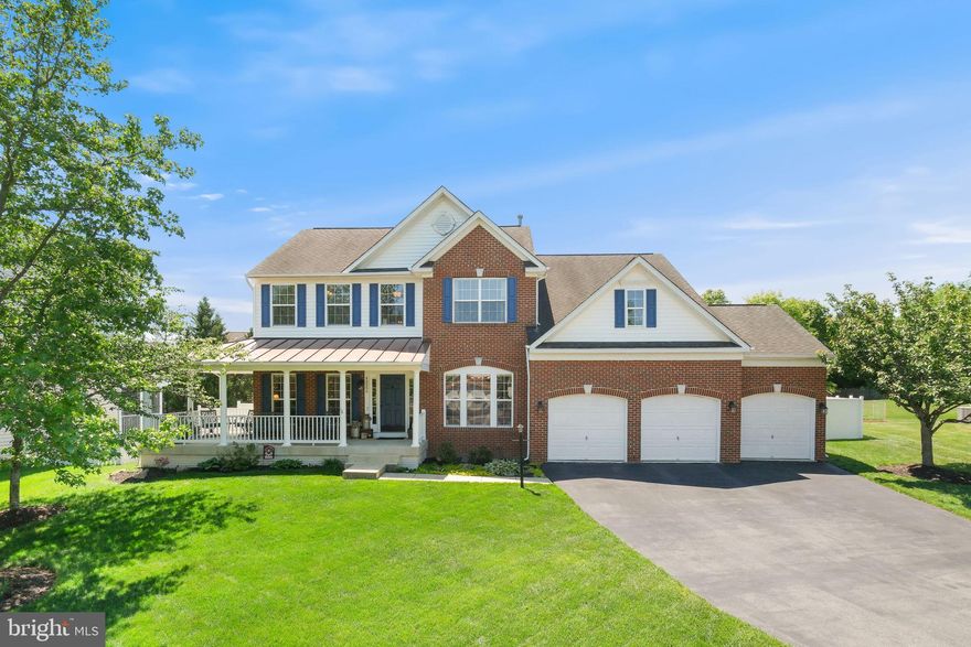 Welcome to 43299 Heather Leigh Court, tucked away on a quiet cul-de-sac in the desirable Cedar Ridge community. This picturesque brick-front Colonial welcomes you with a wraparound porch—a wonderful place to relax on a summer evening and enjoy the peaceful setting. Set on a beautifully landscaped lot, this classic center-hall home offers 4,831 total square feet across three finished levels, with 4 bedrooms, 2 full bathrooms, and a powder room. SEE UPDATES LIST WITH DISCLOSURES. Step inside to bright, inviting spaces anchored by a grand two-story foyer, high ceilings, recessed lighting, extra-wide crown molding, wainscotting, five ceiling fans, and abundant windows that fill the home with natural light. One of the home’s most appealing highlights is the fully fenced backyard retreat, offering a large, level greenspace, garden beds, professional landscaping, a paver patio, and a Jacuzzi hot tub—an ideal setting for relaxing, entertaining, or enjoying time outdoors. The gourmet eat-in kitchen sits at the heart of the home. It boasts black stainless steel appliances, quartz countertops, contemporary cabinetry, subway tile backsplash, a gas range, a farmhouse sink with garden windows, a center island with breakfast bar seating, a built-in work desk, and a pantry. The breakfast area is framed by a sliding glass door that opens to the patio and backyard. The adjoining family room, featuring a gas fireplace, flows seamlessly into the kitchen, creating a warm and connected everyday living space. Formal living and dining rooms, a private office, powder room, and laundry room/mudroom with access to the attached 3-car garage complete the main level. Upstairs, you’ll find 4 bedrooms, all with ceiling fans, and 2 full bathrooms. The expansive owner’s suite offers room for a sitting area and includes an enormous walk-in closet with ample wire shelving.  The generous en-suite bath includes a soaking tub, a separate walk-in shower, dual vanities, and contemporary tile finishes. The walk-up lower level provides an abundance of flexible space, including a large recreation room with room for a home gym, media room, playroom, and more. The bonus room is ideal for guests or as a second home office. Multiple closets and large utility rooms provide excellent storage. Ideally located with easy access to dining, shopping, entertainment, and major commuter routes. The home is adjacent to Belmont Country Club and minutes from Dulles Airport, the Potomac River, parks, and recreation facilities. Don’t miss the opportunity to own in one of the DMV’s most sought-after communities. Note: Presence of security cameras - there is a doorbell camera, three backyard cameras and one garage camera.  All are motion activated.