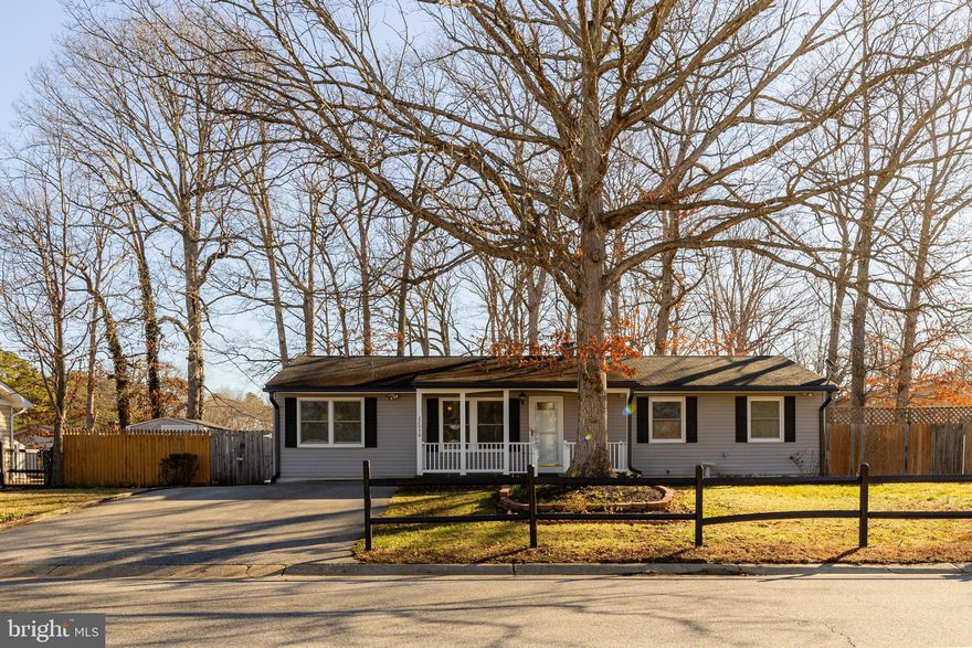 This impeccably cared-for home offers the perfect blend of style and function. Highlights includes beautiful  hardwood floors throughout and a updated kitchen featuring Corian counters, stylish tiled backsplash, and  dimmable under counter lighting. The open-concept family and dining area provide a spacious feel, while the 3-season sunroom adds versatile living space for year-round enjoyment. Featuring 3 bedrooms, 2 full baths, and a fully fenced rear yard, this home offers privacy and convenience in a great  location near PAX River and local amenities.