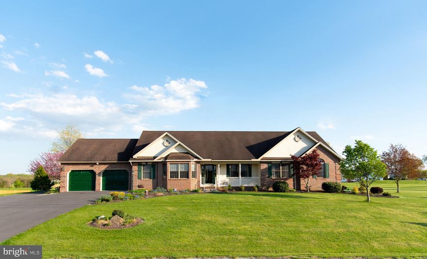 Quality craftsmanship throughout! This Littlestown gem was built as a FOREVER HOME and has it all! Solid wood custom cabinetry and built-ins by Elite Woods, tile, quartz countertops, gorgeous laminate from Zeigler's, 2x6 construction, central vacuum system, Pella windows oversized 2-car garage and large driveway with RV-length pad on side with electrical hook-ups...the list is endless! Relax in your all-season porch, or step out onto your well-manicured lawn and enjoy your peaceful country setting. This home offers 2.02 acres of beauty! The Primary Bedroom is HUGE (22x15), and includes a separate office, walk-in closet, bath with jetted jacuzzi tub, and convenient laundry. Come see the quality and beautiful setting this home has to offer today!