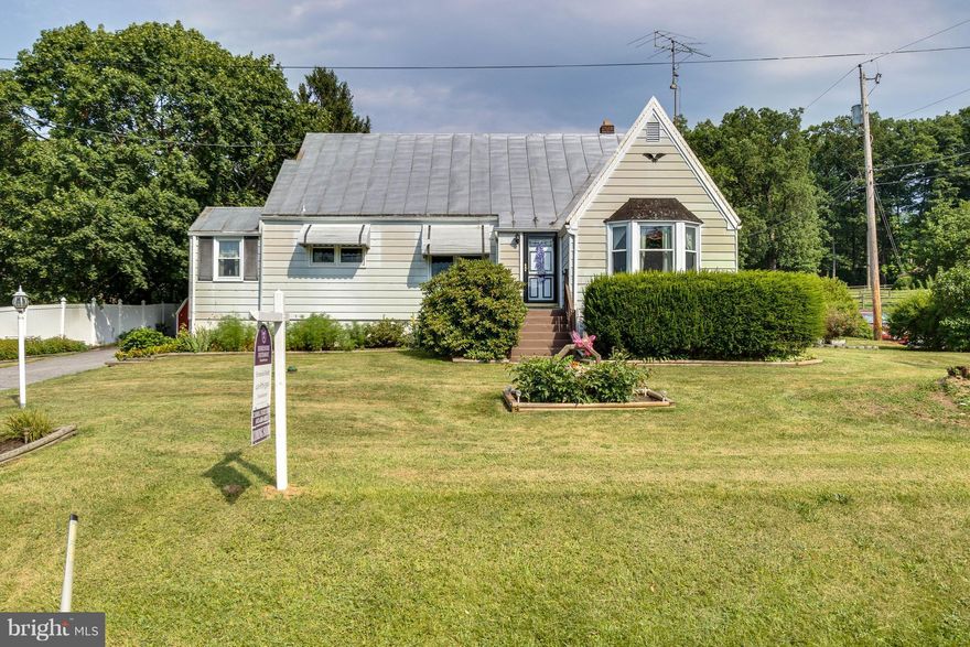 Cute Cape Cod in excellent location on lovely lot.Two bedrooms and bath on main level.  Upper level could be made into large master or playroom. Lower level is partially finished with a large bar and shelving. Eat-in kitchen and separate dining room.  Bright and cheerful throughout.  Hardwoods under carpet.  A must see!  Lots of potential to make it your own.