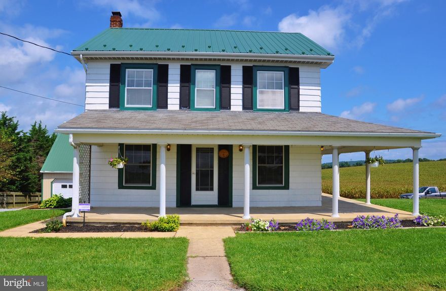 This property offers SOOOOO much...where to begin....36'x56' Pole barn w/12' high and 16' span, PLUS 37'x31' 3 car, two story heated and cooled garage w/workshop, bathroom, and finished and unfinished bonus space.  Large lot with pull through driveway, bonus sheds for even more storage, exquisitely maintained and updated Farm House with lots of room, wrap around porch/deck, and gorgeous craftsman accoutrements.  The wood work in here is beautiful, and the Views off of your deck or wrap around porch are just Stunning.   Systems are updated, steel air lines plumbed in garage.  Home warranty included with acceptable offers.  You must come see this dream home before it's gone.   If you need outbuildings and storage space and appreciate gorgeous 19th century woodwork and construction, and love country living with panoramic views...you need this home.  Schedule an appointment today.
