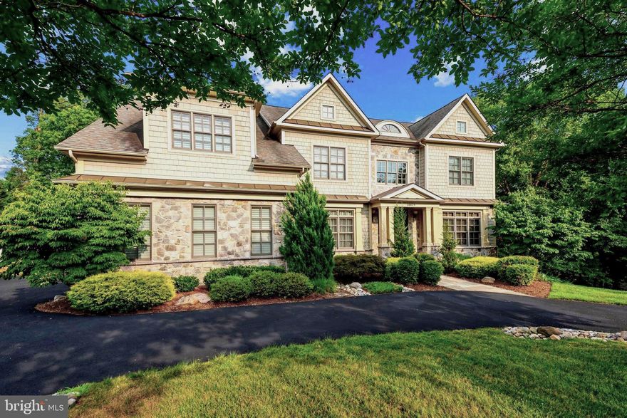 At the end of the tree-lined streets of Kentsdale Estates lies a collection of modern custom residences built by the distinguished Potomac Heritage Homes. Within this exclusive enclave, prominently situated on nearly half an acre of flat, usable land, is a turnkey estate spanning over 7,500 finished square feet of luxurious amenities and finishes, the largest home built by Heritage Homes in the neighborhood. 

Ideal for entertaining as well as everyday living, 10619 Willowbrook Drive is approached via a circular drive, with extra parking on the side, providing a welcoming entry for guests. A stone walkway gracefully leads to the covered front porch, revealing a stately stone and shingle facade. The impressive double-height foyer welcomes you into a functional floor plan filled with natural light streaming through large windows and open, airy spaces. The home is adorned with beautiful windows and trim work and hardwood flooring.  Adjacent to the reception area, the formal dining room creates an elegant ambiance for sophisticated banquets, while on the opposite side, a warm and inviting living room, sitting room, or home office awaits.

The gourmet kitchen, featuring ample cabinet space and a premium appliance suite, serves as the heart of the home with open sight lines to the grand great room. Adjacent to the kitchen is a sun-filled breakfast room that overlooks the screened-in porch and rear grounds, seamlessly flowing into the awe-inspiring great room with coffered ceilings, a custom built-in and an elegant gas and stone fireplace. This space exudes grandeur while remaining intimate. The spacious mudroom and laundry room, equipped with abundant built-ins and cabinets, provide both convenience and functionality.

Ascending the grand staircase reveals the owner's suite, a true oasis with a separate sitting room, custom closets, and a spa-inspired bath featuring a walk-in shower, spacious linen closet, and separate vanities. The upper level also houses three additional large, light-filled secondary bedrooms, each with a walk-in closet and ensuite bath. A generously sized bonus room on this level can be used as a study space or an additional great room.

The walkout lower level, illuminated by walls of windows, is an entertainer's dream. The spacious recreation room, anchored by a floor-to-ceiling stone fireplace, is complemented by a full-service wet bar, an in-home gym, and a theater room. Additionally, a generously sized bedroom suite, perfect for an au pair or out-of-town guests, comes complete with a ensuite bath.

In the rear, total privacy is established through a fully-fenced, flat, rectangular lawn backing to mature foliage, while the oversized deck, screened in porch, and stone fire pit, accommodates all types of outdoor entertaining. 

One of the many highlights of the home includes the premium kitchen appliances: a Sub-Zero refrigerator and freezer, a Wolf range with an oven and a half and six burners, two Bosch dishwashers, a warming drawer, a wall oven, separate microwave, and a hot water dispenser. The home's systems feature three newer HVAC units and two newer hot water heaters. Additionally, the property boasts a three-car garage with epoxy flooring,  a fully fenced in rear yard, a circular driveway, a stone fire pit, multi-room builtin speakers, a generator and so much more!

Blending space, amenities, and style with an unparalleled close-in Potomac location, 10619 Willowbrook Drive exemplifies the perfect home.