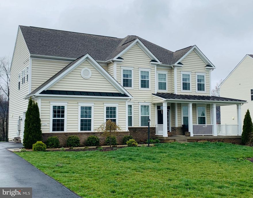 Don't miss the opportunity to see this beautiful colonial style home in The Ridges of Tuscarora! At first glance you will immediately notice the wrap around covered porch at the front of the home. Perfect place to relax and enjoy a peaceful morning. Entering the home you will be mesmerized by the gleaming hardwood floors, upgraded wooden staircase with iron spindles/accents, large office space, spacious dining room and a formal living area with a door to access the covered porch. The Family Room and Kitchen open to each other creating a great space for entertaining. The Family Room hosts cathedral style ceilings and a beautiful fireplace to enjoy year round! The Gourmet Kitchen features a large island, granite counter tops, upgraded cabinetry with hardware, wood floors and stainless steel appliances. A built in wooden cubby, mud room is located directly as you enter from the garage. Upstairs you'll find 4 bedrooms, 2 full bathrooms and a spacious laundry room for convenience! The Master Bedroom provides an enormous amount of space for large furniture and a King size bed. The walk in master closet is the perfect size to accommodate more then one persons personal items- clothing, shoes, purses and accessories. The luxurious Master Bathroom features a large soaking tub, double sinks and a beautifully tiled shower with a bench for relaxation. The finished basement offers a full bathroom with a luxury tiled shower, cabinetry for entertaining & hosting get togethers, large living room an additional space to grow into! Enjoy ALL of this while having a large 1.26 acre  lot with views to die for!