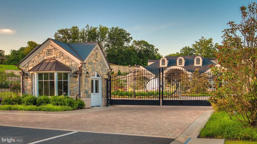 END UNIT // A Rare Opportunity to Own a Premier End Unit in Quarry Springs

Welcome to 8201 River Road, an exceptional end-unit townhome located in Quarry Springs, one of Bethesda’s most prestigious gated communities. Lovingly and professionally decorated, this residence boasts extensive upgrades throughout, making it one of the finest homes in the entire community.

This architecturally striking home blends innovative design with elegant European influences, showcasing limestone accents and expansive glass windows that flood the interior with natural light.

Enter through the elegant front entry or the attached two-car garage. The main level features a wide hallway leading to a private office or guest bedroom, a full bathroom, a powder room, a well-appointed mudroom, and access to the private elevator servicing all four levels.

The second floor unveils a true Chef’s Dream Kitchen, complete with a dramatic 12-foot waterfall island, top-tier appliances, dual walk-in pantries, and a separate bar area—ideal for entertaining. This level also includes a spacious dining area, an inviting living room, and a second powder room.

Upstairs on the third level, discover a serene primary suite with a spa-like ensuite bathroom and a custom walk-in closet. Two additional bedrooms, a full bath, and a laundry room complete this level.

The fourth floor is a showstopping Four Seasons Rooftop Retreat, fully conditioned for year-round comfort. Enjoy two expansive terraces with cascading glass doors that open on both sides, creating an indoor-outdoor experience perfect for entertaining. A wet bar and fireplace add to the ambiance.

This home features Quarry Springs’ most updated kitchen design, modeled after the showcase house, centered around the impressive waterfall island.

Quarry Springs offers unparalleled amenities, including 24/7 staffed security gates, a 10,000-square-foot clubhouse with a pool, hot tub, yoga studio, fitness center, and outdoor fire pit. Nature lovers will appreciate the beautifully landscaped grounds, including the signature Waterfall Rock Garden Park with streams, bridges, and trellis-covered overlooks.

Located in one of the quietest and most desirable sections of the community, this is a rare chance to own an end unit that is both unique and meticulously upgraded.

Don’t miss this extraordinary opportunity to call Quarry Springs home.