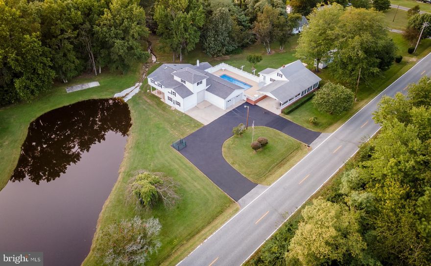 Large  detached garage & work shop with 2784 sq feet of space!.  Previously was a cabinet shop and has 10 HP air compressor with 30 quick disconnects, spray booth, ventilation system, heat, 800 amp service.  there is an office & 1/2 bath, carport area on back of garage 11x24. w/ camper hook up.  There are two 8' doors & one 12' door.   Upstairs has a 2 bedroom apartment, 1 bath  with separate entrance.    Main house has been gutted & ready for  new owner to finish.  In ground pool, 28 x 24 carport.  Shop & gutted house share a well but each are hooked up to public sewer.  Older trailer next to house is used for storage only.   Pond on property is shared by trailer next door which is also for sale for 145,000.  Trailer on separate lot is rented & tenant would love to stay!!! Wired for high speed internet