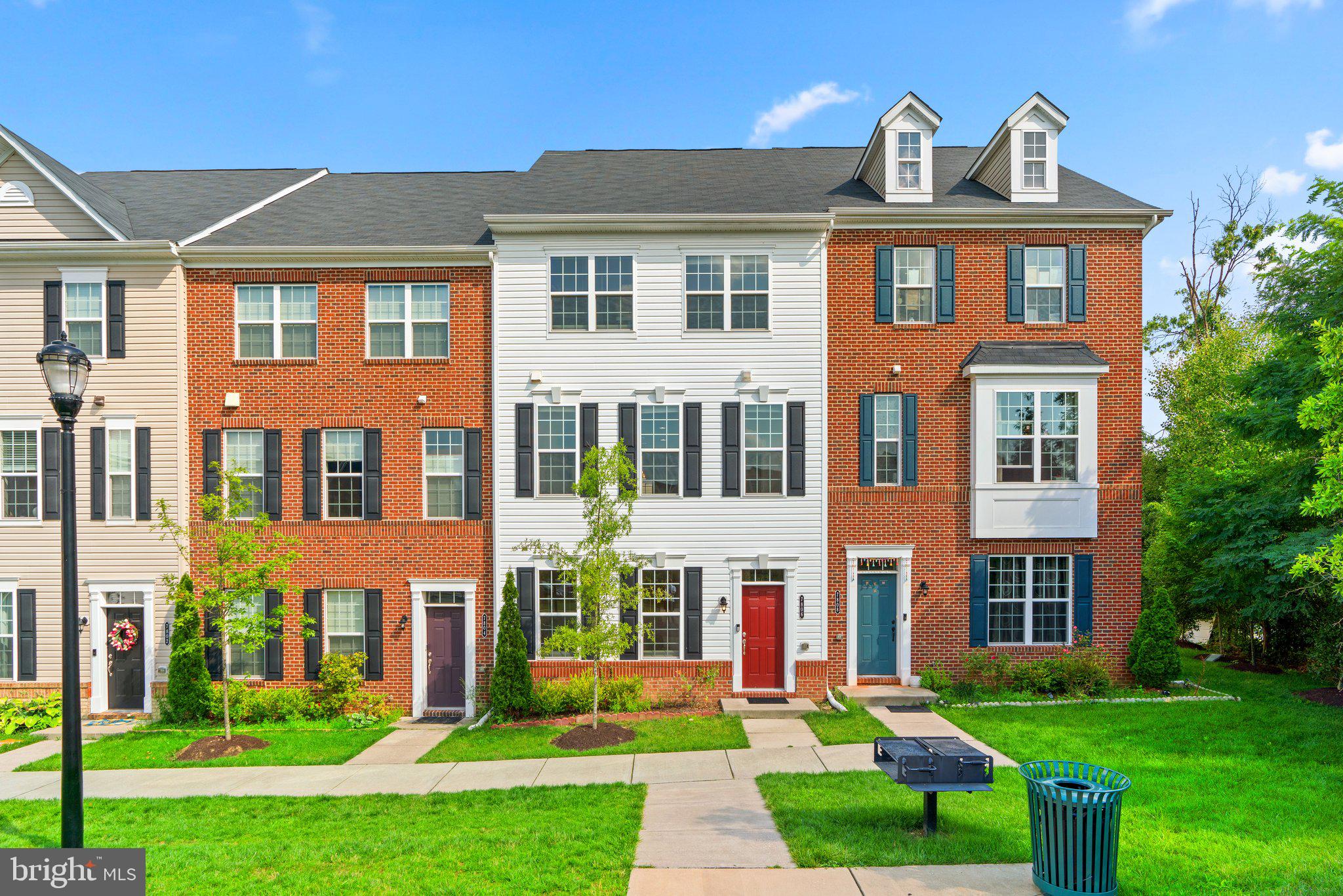 Sun-kissed and gorgeous 4 Bedroom/3.5 Bath interior unit townhome with fresh paint + new carpet/padding + pressure washed deck + manicured landscaping + premium views of courtyard park! Only at Morris Place! Hellooo entry level en suite bedroom or home office/gym as well as interior access to spacious 2-car rear entry garage with fantastic overhead storage/Tesla Wall Connector/extra refrigerator! Upstairs is the marvelous open Dining/Kitchen/Living trio featuring beautiful lighting, long center stage island, espresso cabinetry, stainless steel appliances, organized pantry, coat closet, plus large deck and powder for easy entertaining! Rest and recharge on the third in your very own Primary Suite with two windows, walk-in closet, and 4-piece bath/linen! There are two additional bedrooms just past the hallway full bath and stacked LG Laundry! Plenty of guest parking on the driveway fit for two and unassigned street/lot! Enjoy the community event field/gazebo/sidewalks! Howard County Public Schools! Nearby Target, Walmart, Costco, Trader Joe's, Giant, Harris Teeter, Wegman's, Home Depot, Lowes, and many more retail establishments/restaurants! Close to I-95, Route 100, Route 175, I-295, Route 32, Route 29, Fort Meade, BWI Airport, Rockburn Branch Park, Blandair Regional Park, Lake Elkhorn, The Mall in Columbia, Merriweather Post Pavilion, and Arundel Mills! See you soon!!!