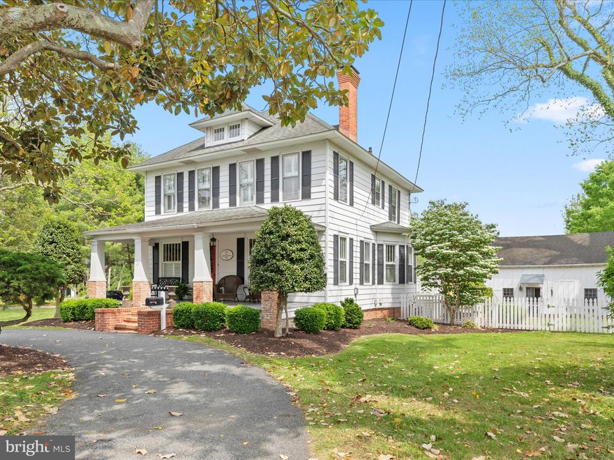 Historically known as The Sheriff Purnell House, as featured in Architectural Historian, Paul Tourat’s book “ Along the Seaboard Side”. The construction of this beautiful American Four-Square home began in circa 1915. The home, as title, belonged to one of the first Worcester County Sheriff’s and his wife Dorothy Purnell. The house, along with the neighbors of South Main Street, were quite social, and known for their fun and festive soirees. As the story goes, The  Harvey P. Pruitt Home, and the storied residence, Waverly were the epicenter of private parties, great music and conversations were known to be the course of many evenings. Again, as the story goes, transportation between the residences was known to be wheel barrels… which later began a tradition on South Main Street, and remains to this day ( !)
Following the passing of the Purnell Family, the 2nd owner’s Dr. & Mrs. Cyril Heinrich purchased the Sheriff Purnell residence. Dr. Heinrich was a veterinarian and treated large animals in the existing barn on the property, which at that time was a classic barn inclusive of a dirt floor.  The Heinrich Family sold the residence to the 3rd owners, Sidney & Sherrie Beckstead upon Mrs. Heinrich’s passing in 1993.
Upon purchasing The Sheriff Purnell Residence, Sidney & Sherrie embarked on a quest to lovingly restore each aspect of this turn of the Century historic home, that is elegantly tucked behind a majestic Magnolia tree, and circular driveway in Berlin’s Historic District.
Sherrie & Sidney contracted a respected member of The American Society of Interior Designers ( ASID), Susan Moore, to begin the process of designing a plan to restore the home to its original historic design. A master craftsman was hired to restore the English Fireplace, woodwork moldings, and remove carpet and wallpaper from each room.  The custom-made fencing, the Chippendale railing, and countless other custom works were under the direction of Sid & Sherrie, and carried out by the incomparable master craftsman Dennis Smith, who continues to care for and oversee this beautiful residence for Sherrie while she travels for business.
The Beckstead’s photographed the restoration of this home, and they are available to view, and will be gifted to the new owners.
Phase II: Restoration of the Barn- Sid & Sherrie were committed to making this space a beautiful living space with attached brick walkways and patios for their 4-season outdoor/indoor living lifestyle inclusive of many parties celebrating life, love and friends’. The barn design elements included a concrete floor, and added kitchen amenity, a full bathroom with a second story used for office and guest accommodations. Many Sunday Football games, with outdoor fire pits, steaks on the grill, and great friends created the atmosphere that the Beckstead’s embraced while enjoying the Sheriff Purnell House.
Phase III: The Carriage House A desire of Sidney’s, a place to house his sports car, his beloved John Deere tractor, and an art studio, where he sketched and painted not only  his beautiful jewelry pieces, however, his masterful oil painting, and pen and ink sketches.
Sherrie & Sid created all of the gardens and planting on the property, inclusive of the tree lined driveway to the back of the house. The Beckstead’s added the driveway, and one of their favorite things was to see the gardens and trees in bloom, the barn, the carriage house and the main residences north side when arriving on that driveway to their home at The Sheriff Purnell House. Sherrie & Sid lovingly restored, treasured and acted as stewards of this historic Berlin property, all the while serving up the best parties on Main Street. 1993- 2025. This beautiful Berlin treasure now awaits it's next loving occupants.