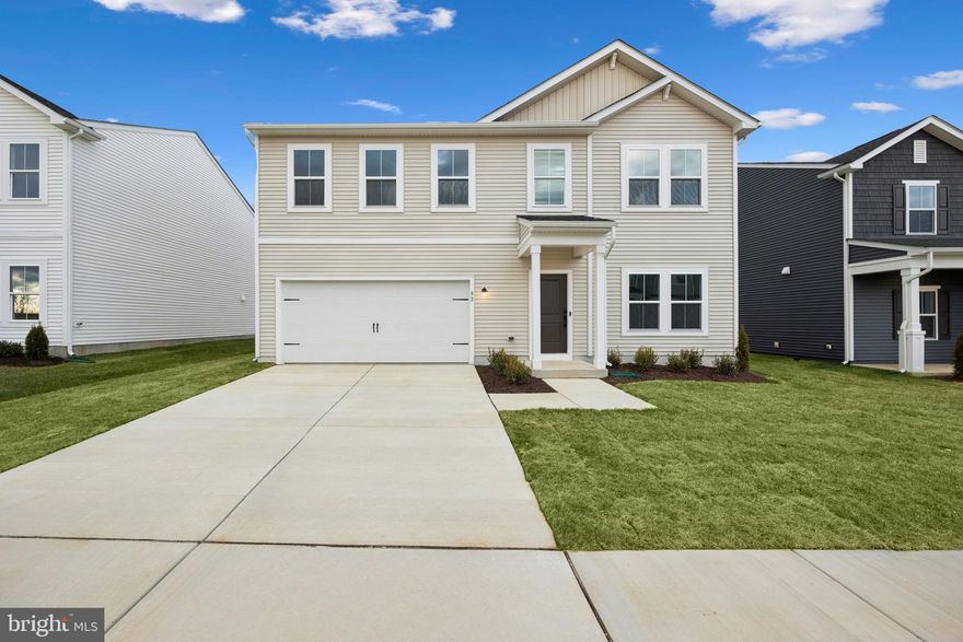 Immediate Move In!  Welcome home to the Water Lily, a stunning 5-bedroom, 3-bath home designed with modern elegance, comfort, and functionality in mind. The main level features an open flexible living space perfect for additional living space or work-from-home needs. Enjoy an open-concept kitchen complete with a center island that flows seamlessly into the dining area and spacious family room, ideal for everyday living and entertaining. Additionally, you will find an extra bedroom and full bath on the main level, ideal for guests, in-laws, or private office! The upstairs includes a central loft area, 3 secondary bedrooms, laundry room and spacious Primary Bedroom. This home also features our designer curated Farmhouse Look which includes 42” staggered upper cabinets and floating shelves, adding a sense of charm and providing a unique space to display your favorite decor or dinnerware. A Farmhouse white apron front sink completes the modern Farmhouse Look along with sleek seamless Quartz kitchen countertops and stainless-steel appliances. Vintage inspired lighting, rustic main level flooring, and farmhouse finishes complete the Farmhouse charm throughout the home. The Water Lily at Huntwell West is conveniently located within minutes from shopping, dining, and outdoor adventures. Explore nearby gems like Historic Harpers Ferry, Historic Shepherdstown and Downtown Charles Town, just minutes from Hollywood Casino at Charles Town Races. Enjoy close proximity to commuter routes to Washington, D.C., Frederick, MD, and Northern Virginia. Call today to schedule your private tour! Ask about our closing costs assistance with KHovnanian American Mortgage. **Photos are of a decorated Oleander Model Home and similar home/features and may not reflect current home finishes. Pricing, options, and promotions are subject to change without notice.