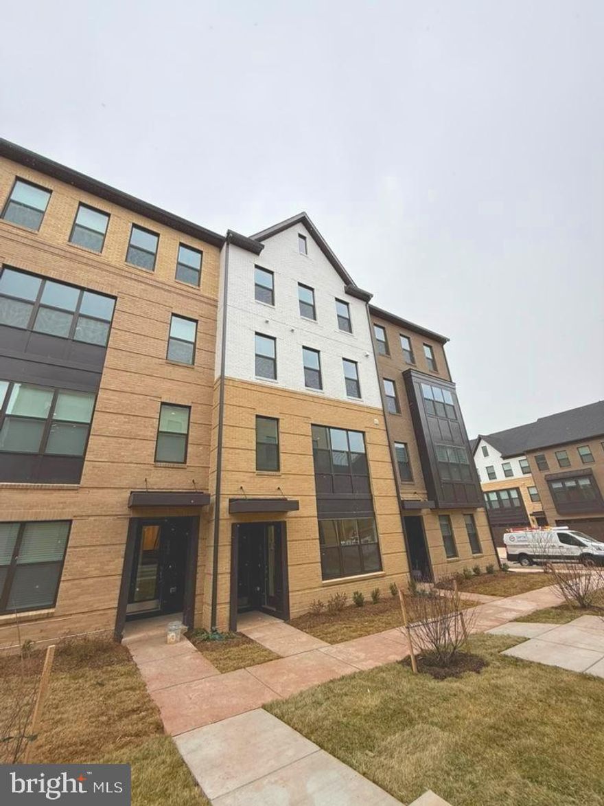 Luxury new build condo! Residents here can experience a peaceful lifestyle surrounded by nature, with all you need within reach. The community features numerous small parks and seating areas, perfect for relaxation. Open green spaces, a bocce court, and a playground offer something for everyone to enjoy. Plus, with a variety of shops, restaurants, and entertainment just a short walk away, convenience and a lively atmosphere are always within reach. Tysons Corner and Washington DC are easily accessible via metro. George Mason is only 10 miles from the area. The main level boasts a spacious and bright open-concept design, enhanced by elegant vinyl plank flooring and plenty of natural light from numerous windows. Upstairs, the primary suite offers a private escape with two walk-in closets and a luxurious bathroom featuring a double vanity and a stand-in shower. Two more bedrooms—one with access to a balcony or deck—a full bathroom, and a conveniently located laundry room complete the upper floor. Pets are considered on a case-by-case basis.