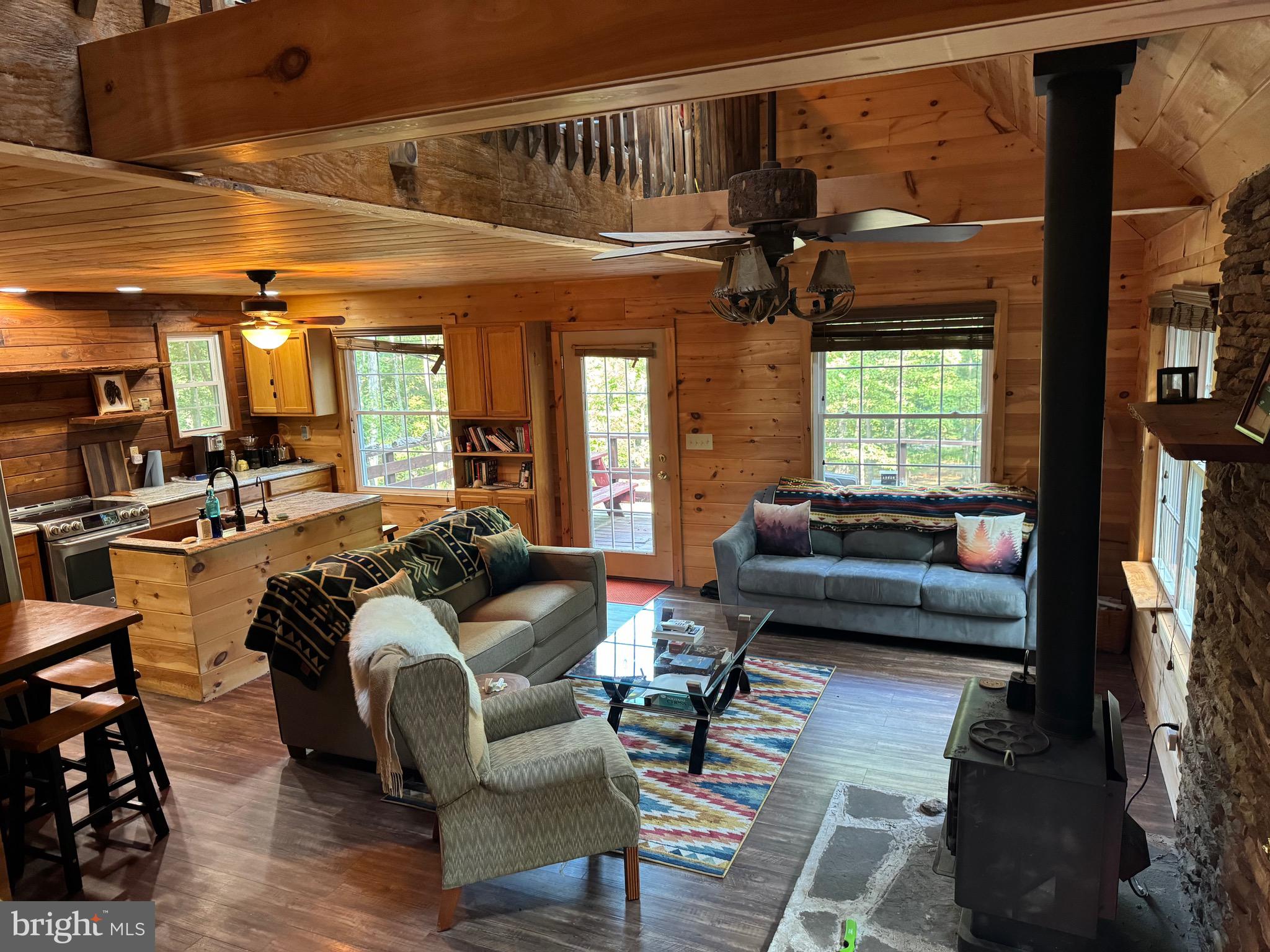 Back on the Market!! Ignore the days on market for this gem. It has been under contract twice and has fallen through both times but this is no fault of the owner or the house. It has a new water heater and all new flooring!! Welcome to your private retreat on 10 wooded acres near the popular South Branch River in Moorefield, WV. This cozy retreat offers the perfect blend of rustic charm and modern comfort, while being surrounded by natural beauty. It's close proximity to the River's public access point makes it the perfect getaway for outdoor enthusiasts and lends itself well to being an AirBnb rental opportunity. The 10 usable acres and large outbuilding gives this property ample opportunity for expansion. The outbuilding could easily become an extra sleeping quarters. Insulation has already been started. Less than 10 minutes from Moorefield the home is secluded yet accessible offering privacy without sacrificing proximity to town. Whether you are looking for a peaceful getaway or an investment opportunity this charming cabin is the perfect escape from the hustle and bustle of daily life. Embrace country living with endless opportunities right at your doorstep.