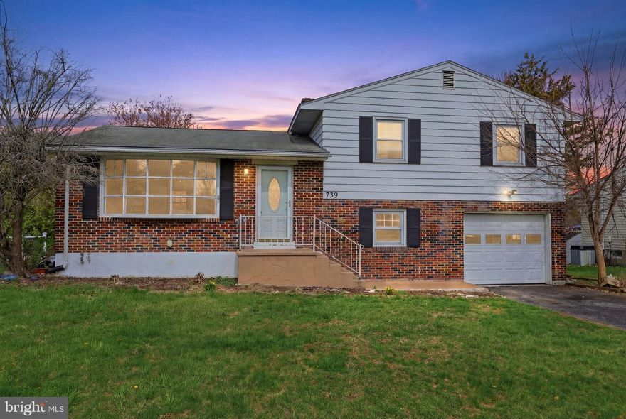 Welcome home to this charming 3-bedroom split-level located in the desirable East Penn School District. The main level features a bright and inviting living room and dining room, highlighted by a large bay window that fills the space with natural light, along with hardwood flooring. The eat-in kitchen offers ample cabinetry and plenty of room for everyday dining.  Upstairs, you’ll find three generously sized bedrooms, all with hardwood floors, along with a hall bath. The lower level provides additional living space with a family room, a convenient half bath, and a mudroom/laundry area with direct access to the spacious backyard—perfect for entertaining or relaxing. Additional highlights include a 1 car garage, basement and attic with pull-down stairs, offering plenty of storage. Conveniently located within walking distance to Emmaus High School and close to parks, shopping, and dining