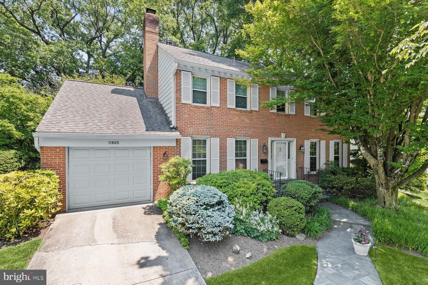 Set on a private, beautifully landscaped lot in the sought-after Montrose Woods community, 11805 Hitching Post Lane offers a meticulously maintained Colonial with 4 bedrooms, 2 full bathrooms, and 2 half bathrooms across three finished levels and approximately 3,850 square feet of living space.
Upon entering, a welcoming foyer opens to the formal living room and adjoining dining room, ideal for both everyday living and entertaining. The gourmet kitchen features generous counter space, a breakfast area, and direct walkout access to the home’s serene rear patio and landscaped backyard. A cozy family room with beamed ceilings, built-in shelving, and a gas fireplace completes the main living spaces. A powder room and laundry room with convenient garage access round out the main level.
Upstairs, the home offers four spacious bedrooms and two full bathrooms. The expansive primary suite includes a walk-in closet and a dual-vanity en-suite bath. Three additional bedrooms each feature ample closet space and share a well-appointed hall bathroom with dual vanities and a tub/shower combination.
The finished lower level is a versatile recreation and entertaining space, featuring a large recreation room with a wet bar, powder room, and a wall of closets. An adjacent game room with built-ins and a utility room complete with a cedar walk-in closet offer storage and functionality.
Montrose Woods is a peaceful, family-friendly neighborhood located near top-rated schools and within close proximity to numerous parks and community pools. Commuters will appreciate the convenient access to I-270, I-495, and the North Bethesda and Grosvenor Metro stations. Nearby shopping, dining, and entertainment options abound at Pike & Rose, Park Potomac, Cabin John, Wildwood Shopping Center, and Rockville Pike.
This idyllic retreat in the heart of Rockville seamlessly combines privacy, comfort, and convenience offering an exceptional place to call home.