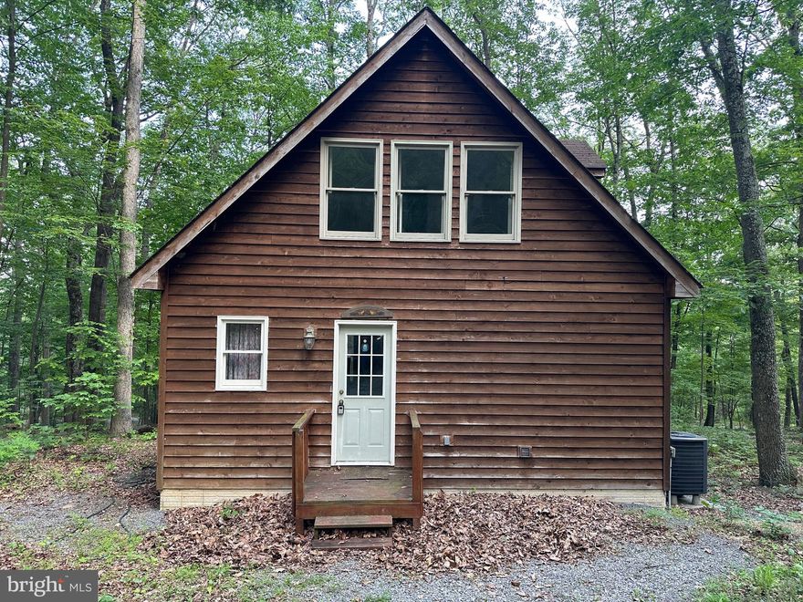 Check out this awesome 2 bedroom 2 bath chalet located in Coolfont Mountainside in Berkeley Springs! This home offers multiple decks and washer and dryer on the main floor. Theirs a full bath on each level of the home. The community offers a swimming pool, hot tub, and hiking trails. The community is also airbnb friendly! Home could use some cosmetic repairs such as flooring and paint, that gives you the chance to make it your own slice of WV!  Come check it out today! Won’t last long at this price!