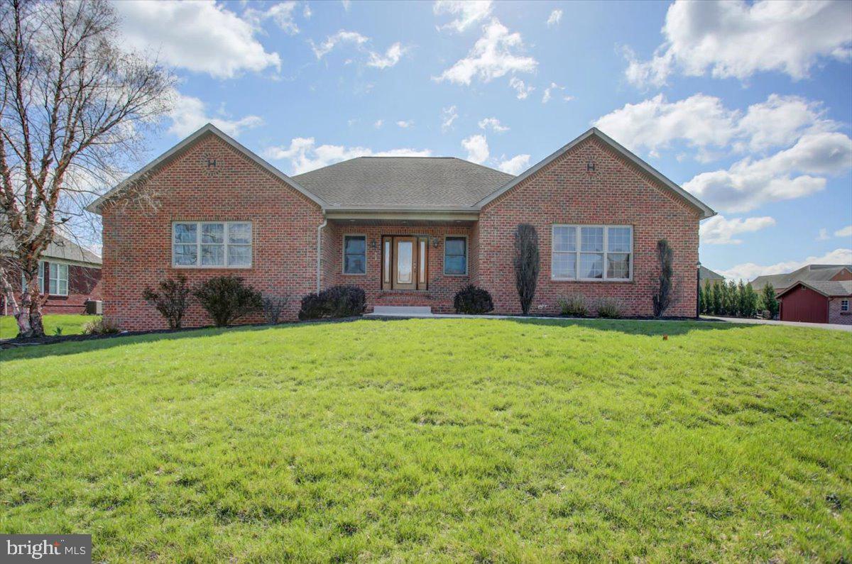Beautiful quality all brick rancher in Heritage Estates. This 4-5BR rancher is larger than it looks boasting almost 6,000 sq ft of living space! this home is the perfect place for entertaining, single level living, all the while being close to downtown amenities! Take a tour for yourself and see the quality built features that has been newly painted throughout, beautiful wood trim, cathedral ceilings, oversized two car garage with ample storage areas, large closets and more! Step down to the lower level that has been completely finished with new plank flooring, paint and lighting fixtures. Complete with a movie room or convert one of the other rooms into a bedroom or two! Fully equipped bar for entertaining, with plenty of space for that poker or pool table. Walk out the lower level entrance to step outside to the rear patio for those upcoming summer nights. You don't see this kind of floorplan often with these updated amenities......Schedule your visit today!