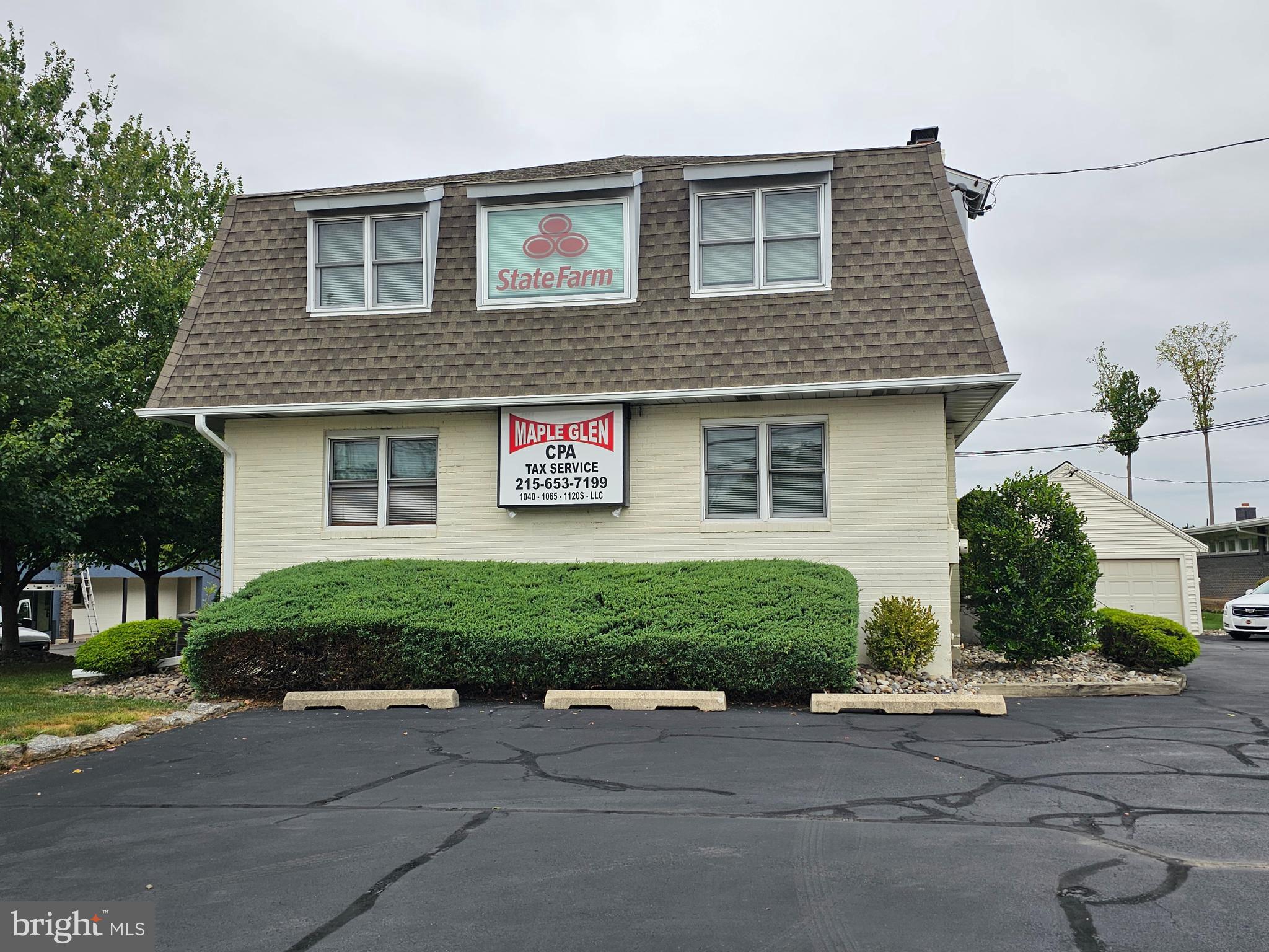 Meticulously maintained office building in Maple Glen. Awesome location on Rt 63 (WELSH RD) with excellent exposure to an abundance of traffic. Huge illuminated sign awaiting your very own marque. This property was used as a Real Estate Office for the past 50+ years. Second floor currently rented to a State Farm Insurance Agency. This property is in move in condition featuring multiple offices on first floor with a reception area and one rest room. Second floor features a huge open area, one large office a small kitchen and a restroom. Full basement for storage. Three car garage, new roofing (2021) on all buildings. New central air conditioner with heat on second floor. Gas heat and central air on first floor (compressor replaced 3 years). Large parking lot, perfect location for another real estate office, title company, medical or professional use. Great for a contractor's office building. Located on Rt 63 between Limekiln Pike and Norristown Rd. Owners are former Real Estate Broker and agent. 24hrs+ notice to show property