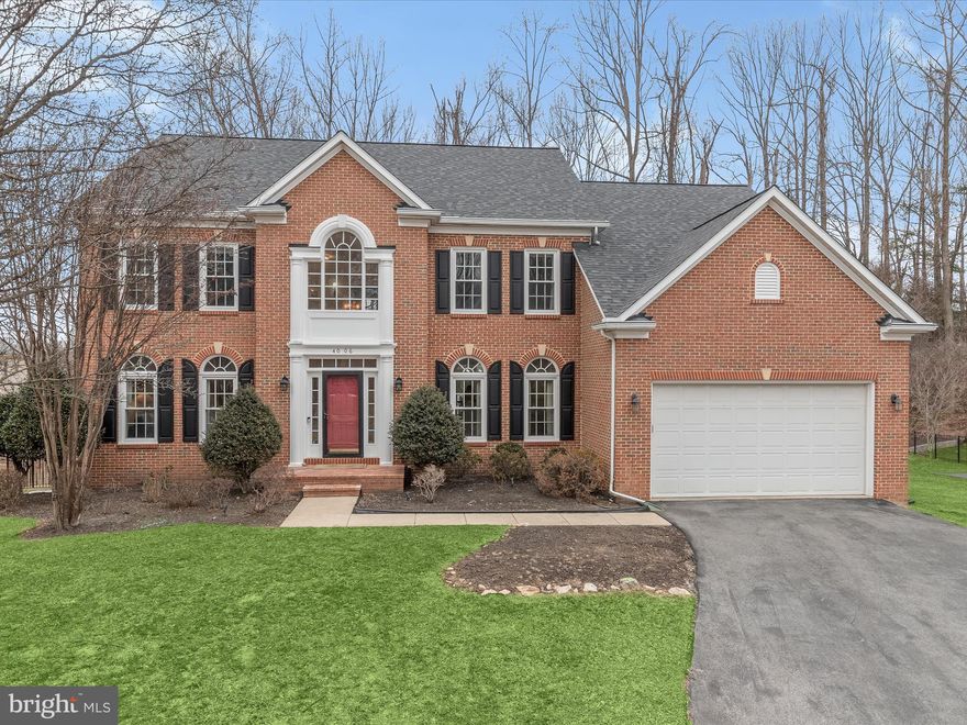 Nestled on a premium lot, this stately brick colonial in The Preserve at Small’s Nursery offers an exceptional blend of luxury, comfort, and modern convenience. With nearly 5,000 square feet of exquisitely finished living space, this home is designed for both grand entertaining and everyday ease. Architectural details, soaring ceilings, and elegant moldings enhance the sophisticated interior, while an expansive backyard with a deck, flagstone patio, and fenced lawn creates a private outdoor retreat.
A striking two-story foyer welcomes you into the home, where refinished hardwood flooring flows seamlessly throughout the main level. The formal living and dining rooms sit opposite one another, each offering distinct character—Palladian windows in the living room provide an abundance of natural light, while the dining room is accented by a tray ceiling, setting the stage for refined gatherings.
At the heart of the home, the gourmet kitchen is complete with 42-inch cabinetry, stainless steel appliances, a gas cooktop with double wall ovens, and an expansive island with a breakfast bar. A breakfast area, bathed in natural light from two atrium doors and transom windows, provides direct access to the deck. The adjacent family room impresses with a soaring vaulted ceiling, a cozy gas fireplace, and floor-to-ceiling windows topped with transoms, offering picturesque backyard views.
A main-level home office is an ideal workspace, featuring custom built-in bookcases, and hardwood flooring that extends seamlessly from the main living areas. Additional conveniences on this level include a powder room, a laundry room, and two staircases with refinished banisters for added elegance and cohesion.
Upstairs, the luxurious primary suite serves as a private sanctuary, boasting a tray ceiling, two walk-in closets, and a spa-like en-suite bath with a double vanity, soaking tub, and a tiled shower. Two additional bedrooms, one with custom board and batten trim, share a well-designed full bath with a double sink vanity, while a fourth upper-level bedroom enjoys its own private en-suite bath.
The fully finished, walk-out lower level adds even more living space. A spacious recreation room offers direct access to the patio through an atrium door, seamlessly blending indoor and outdoor living. A fifth bedroom on this level is designed with accessibility in mind, featuring a luxury full bath with heated floors, a floor-to-ceiling tiled shower, and thoughtfully placed grab bars for added safety. An expansive storage room completes the lower level.
The outdoor space is just as impressive as the interior, with a composite deck overlooking a beautifully landscaped, flat backyard. A paver patio below provides additional space for relaxation or entertaining, all within the privacy of a fully fenced yard.
Completing this incredible home is an attached two-car garage with epoxy flooring, offering both practicality and polished style. Recent upgrades provide peace of mind, including a new roof (August 2019), two new AC units (main level - March 2019, upper level - August 2023), a new hot water heater (July 2020), and upgraded energy-efficient windows (2020) with a transferable warranty. The kitchen has also been enhanced with a new refrigerator, dishwasher, and double oven (October 2018), a new microwave (January 2021), a new gas cooktop (October 2020), and a recently installed kitchen sink and garbage disposal (September 2023).
Located in a sought-after community with scenic walking trails and no-through traffic, this home offers an unparalleled balance of privacy and convenience.  Just minutes from Olney and Rockville, it provides easy access to major commuter routes, including the ICC, Routes 97 and 28, I-495, I-270, I-95, and the Metro. Washington, DC, Baltimore, and multiple airports are all within a 30-minute drive. Offers being reviewed Sunday, 2/23. Respectfully, please send all offers by 8pm.