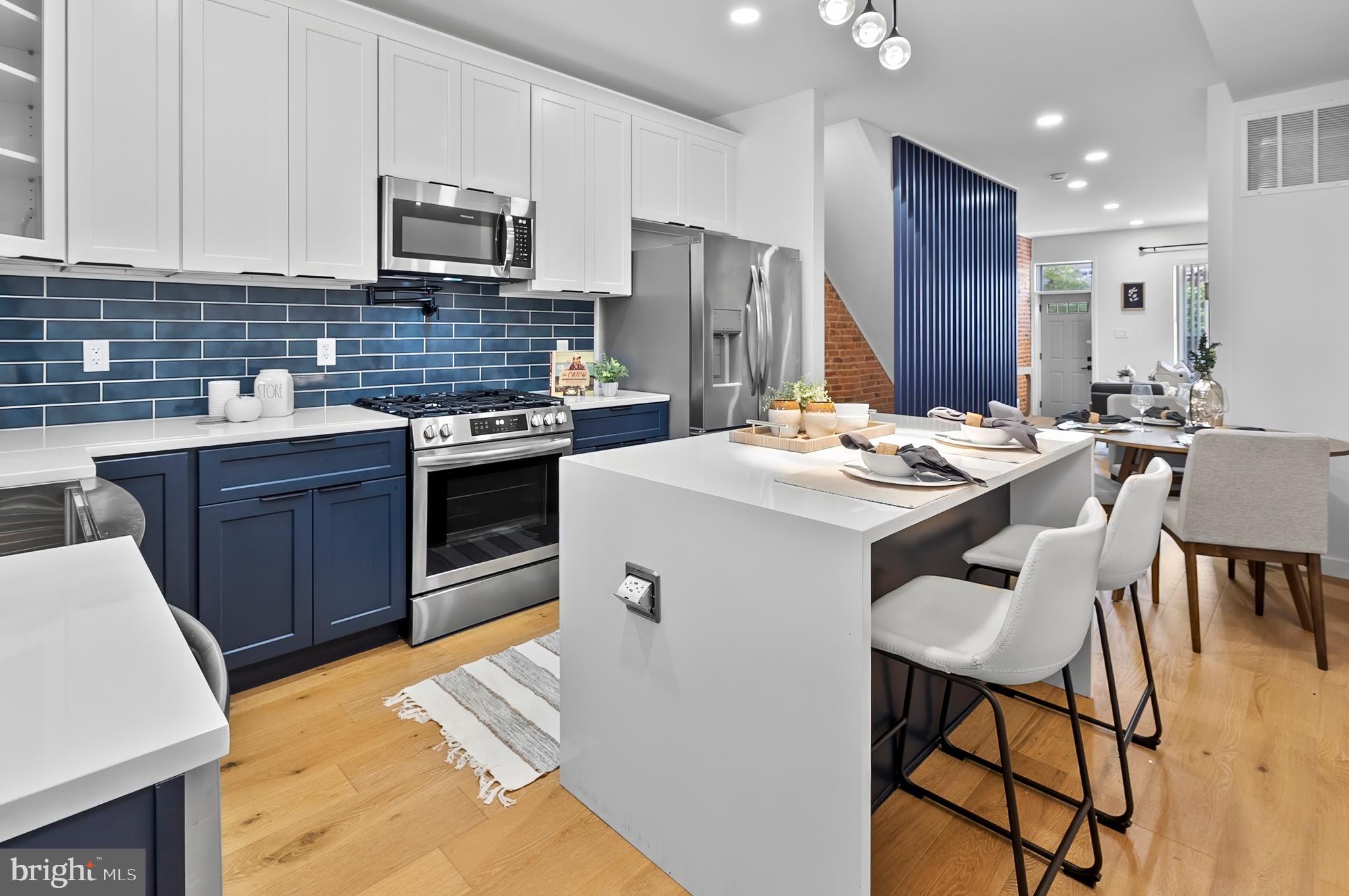 Welcome to 3306 E Lombard Street — Where High Design Meets Everyday Comfort
This fully renovated 3-bedroom, 3.5-bath rowhome in East Baltimore checks all the boxes for a buyer who wants stylish finishes, smart design, and walkable city living without the noise or hassle.
Step into a sunlit main level featuring rich hardwood floors throughout, a sleek electric fireplace, and a modern metal slatted accent wall that brings personality to the space. The kitchen is a true showpiece, designed for both beauty and function — complete with a dramatic waterfall island, drawer storage, and custom lighting that creates the perfect mood for anything from brunch to wine night.
Upstairs, you'll find two spacious bedrooms, each with ceiling fans and great closet space, plus two full bathrooms with automatic lighting and high-end finishes. The top floor even includes a private deck — perfect for enjoying your morning coffee or watching the sun set over the city.
The fully finished basement offers a third bedroom, another full bath, and a flexible space ideal for guests, a second living room, or your dream home office setup. A convenient half bath on the main floor makes entertaining easy, and every detail in this home feels thoughtful and elevated.
While the home offers street parking, you'll quickly fall in love with the walkable neighborhood, where Patterson Park, local cafes, shops, and restaurants are just minutes away. This block is quiet, charming, and ideal for anyone craving a mix of city energy and personal peace.
Best of all, this home qualifies for Baltimore City grants for first-time buyers, making it a smart and stylish move for your future.
Ready to fall in love? Schedule your private tour of 3306 E Lombard Street today.