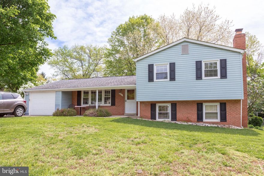 Attractive three bedroom split level with extra room for office or den.  New carpet in living room extends down to cozy family room with fireplace.  Enjoy the spacious sun room off the dining area with access to a large back yard with shade trees.  This won't last long in today's market!