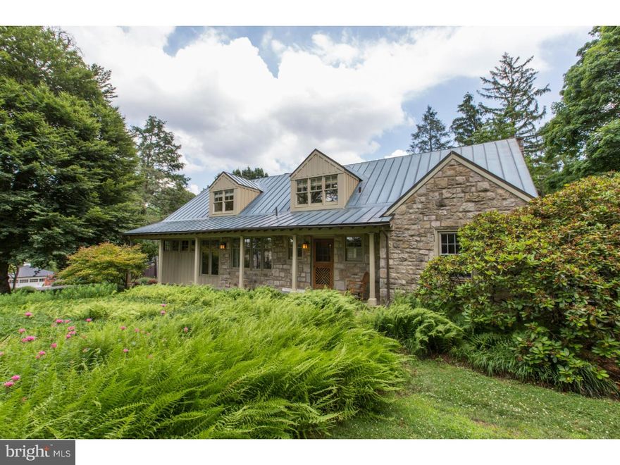 Fantastic expanded mid-century stone & cedar Cape Cod-style house in premier Wyndmoor location at the end of a private cul-de-sac.  Its many quality upgrades include a stunning family room addition with wood ceiling and rustic fireplace reminiscent of a Western ski lodge, a well-equipped kitchen with cherry cabinets, granite counters and stainless steel appliances, a beautiful stone patio, and standing-seam copper roof.  Another key feature is a first-floor bedroom (now used as an office) and renovated full bath, great for older guests.  The second floor has a beautiful, large master bedroom with 2 closets and private bath, 2 more spacious bedrooms, a hall bath, linen closet, 2 storage closets, and 2 charming sitting areas, perfect for curling up with a good book.  Connected to the main house by a breezeway, the current owners built a 2-car garage with huge 2nd floor studio/office/guest suite with full bath and deck, offering many potential uses. The large, professionally landscaped lot includes a 2005 in-ground pool and sweeping views of open space.