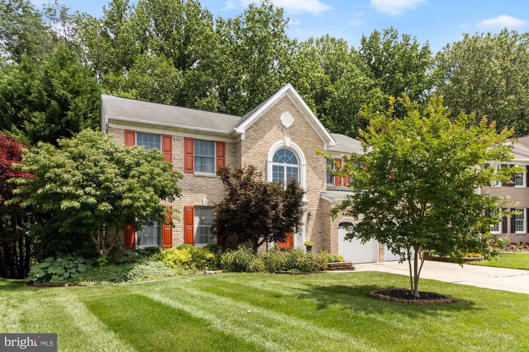 STUNNING 5 BEDROOM COLONIAL IN DESIRABLE PATTERSON MILL SCHOOL DISTRICT! Move right into this bright, spacious, and beautifully maintained home nestled on a premium, private landscaped lot that backs to mature trees. Impressive 2-Story Foyer with hardwood floors and dramatic atrium window. Formal living & dining rooms w/hardwood floors, crown moldings &chair rails. Gourmet kitchen w/center island, ceramic tile flooring/backsplash, recessed lighting, and breakfast area w/access to large deck. Sunken family room off kitchen w/gas fireplace. Upper level features new carpeting, a spacious landing, and convenient laundry area. Expansive primary bedroom w/cathedral ceiling, walk-in closet, and luxurious en-suite bath with garden tub and separate shower. Finished lower level features in-law quarters w/bedroom, full bath, service bar w/microwave, living area with fold-down counter &walk-out to rear patio. Huge storage room w/built-in shelving. Ample parking w/driveway and 2-car garage *** A GREAT FIND! DON'T MISS THIS BEAUTIFUL HOME! ***