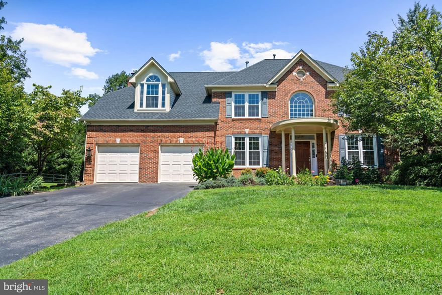 Serenely located on over half an acre of nature-filled land with mature flowering trees, lush, manicured grounds, and a koi pond, this spectacular home offers a tranquil retreat.  Featuring five bedrooms, four-and-one-half baths on three full levels of living, the open-concept floor plan with generous room sizes is ideal for everyday gatherings and entertaining. There is an abundance of natural light through beautiful brand new oversized windows, refinished hardwood floors, crown moldings, and recessed lighting. The grand two-story foyer has soaring ceilings and a gorgeous Palladian window, and it flows seamlessly to the formal living room and the elegant dining room with wainscoting. The eat-in gourmet kitchen is anchored by a center island with a breakfast bar and features updated stainless steel appliances, granite countertops, and a sun-drenched breakfast area with a Bay window. The chef’s kitchen is open to the family room, which enjoys a gas fireplace and sliding glass doors to a peaceful back deck. The expansive rear deck has a dining area with a pergola above that provides the perfect setting to enjoy the outdoors overlooking the verdant setting. A handsome den and a lovely powder room complete the first level of this remarkable home. The upper level with new carpet boasts the expansive primary suite with a sizable walk-in closet and an en suite full bath with a separate luxurious soaking tub and dual sinks. There are also four additional bright and spacious bedrooms, two full baths, and an attic above for even more storage. The lower level provides wonderful entertaining spaces, including a spacious recreation room with a wet bar, two beer taps, and a drink fridge, a game room, an exercise room, as well as a media room. A bonus room, a full bath with a steam shower and ample storage space are also located on the lower level. Additional offerings include an attached two-car garage with two bays and three overhead storage racks, a private backyard putting green, an adjacent storage shed, and full-yard sprinkler system that waters by zone. New roof, windows,and both furnaces and AC units replaced in 2022.   Square footage was pulled from tax record and is deemed reliable but should be independently verified. 12805 Talley Lane delivers a perfect blend of tranquility and convenience with easy access to many amenities, including shopping centers, restaurants, parks, trails, and recreational facilities, as well as to I-270, downtown Bethesda, Rockville, and D.C.