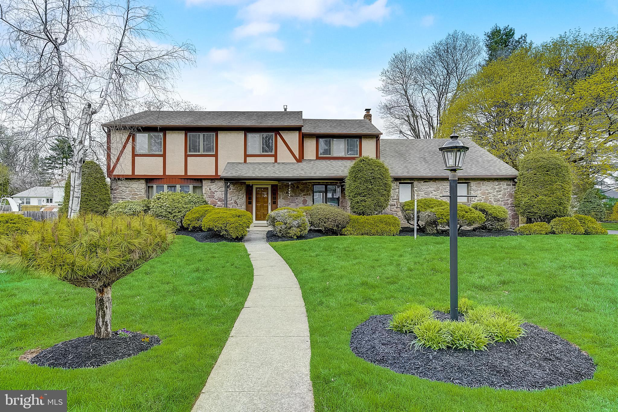 Welcome to this lovingly maintained spacious 5 bedroom 2 ½ bath colonial with 2-car garage in a picturesque neighborhood.  Upon entering you are greeted by an open 2 story foyer with an elegantly curved staircase and crystal chandelier. To the left of the foyer is the living room and dining room with wood flooring. To the right of the foyer is a 24’ x 13’ family room complete with a charming brick fireplace and built-in shelving. Off the family room is the laundry room with half bath conveniently located next to the 5th bedroom/office/home gym and door to garage. The eat-in kitchen with pantry faces the back of the house overlooking a patio, inground heated pool, and privacy fence. The foyer stairs lead to a large landing that wraps around the second floor and ends at the main bedroom, with a full bathroom with a stall shower, vanity dressing area, and walk-in closet. An additional 3 spacious bedrooms with generous closet space, full bathroom, seated window nook, and 2 hall closets complete this floor. The original hardwood flooring is well-preserved under the carpeting in the master bedroom, hallway, and stairs. The house features recessed lighting throughout and an unfinished basement. This beautiful home is a rare 5-bedroom find in the award-winning Lower Moreland school district, and only a short .2 miles to Pine Road Elementary School. Nearby Pennypack Trails and Masons Mill Park and less than a 30 min drive to downtown Philly!