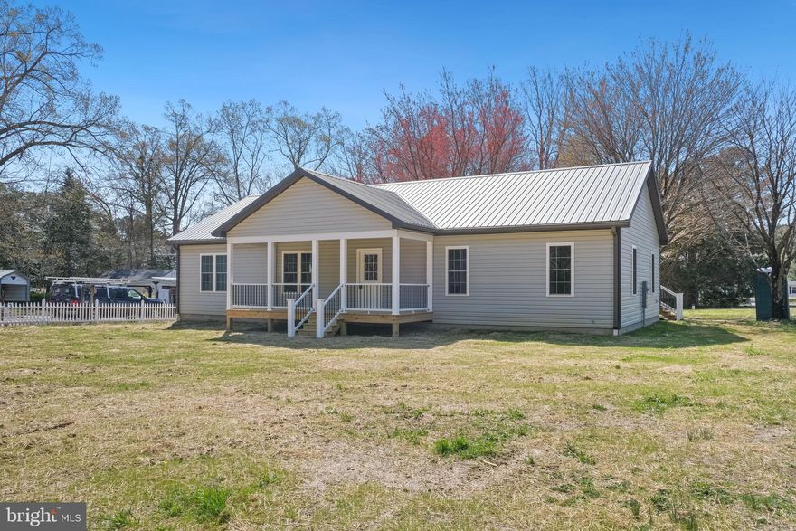 Stunning new construction on 0.60 acres with 3 bedrooms, 2 baths, and 1,740 sq ft of beautifully finished space. Designed with both style and function in mind, this home offers LVP flooring throughout, granite countertops, soft-close cabinets, and a tankless water heater. Exterior features include a welcoming covered front porch, rear deck, and metal roof. Every detail has been carefully selected to create a home that feels both modern and inviting.