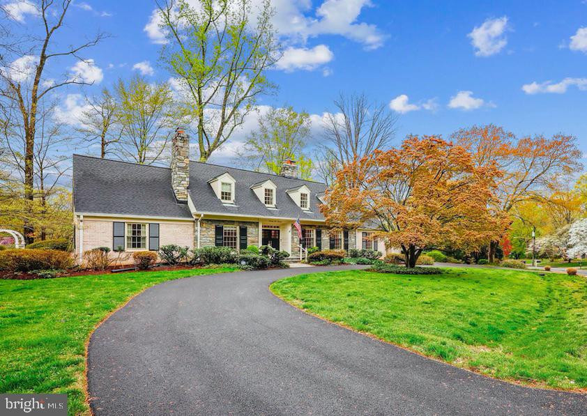 Welcome to 7100 Darby Rd. A grand home located on a large corner lot in the sought-after Bradley Hills Grove Community! The inviting entry foyer leads you into a spacious main level with formal living room featuring 1 of 4 fireplaces, formal dining, the family room provides fireplace number 2, wet bar & large picture window looking out onto flagstone deck & backyard. The renovated chef’s kitchen features custom cabinets, granite counters, high-end stainless-steel appliances including 5 burner gas cooktop & double wall oven as well access to deck. The main level also features a home office with built-in shelving & the 3rd fireplace, a spacious primary suite with 2 large closets (1 walk-in), gorgeous renovated primary bath as well as a 2nd main level bedroom with renovated bath.
The splendid curved staircase leads you to the upper level offering 2 bedrooms and renovated hall bath. Walk down the hall to an additional bedroom featuring a renovated en-suite bath.
As you walk down into the lower level, you’ll find the walkout to the backyard & deck. The rec room is perfect for entertaining with the 4 fireplace, pool table & brand-new carpet. Large storage area rounds out the lower level. A large 2 car garage provides additional storage area. Renovations & updates abound in this wonderful home including fresh paint throughout, refinished hardwood floors, renovated kitchen & baths, high-end Pella windows, HVAC, 75 gallon water heater, whole house water filter, solid mahogany front doors, all GAF architectural shingle roof, gutters, downspouts & paved driveway. This is truly a special home that should not be missed!