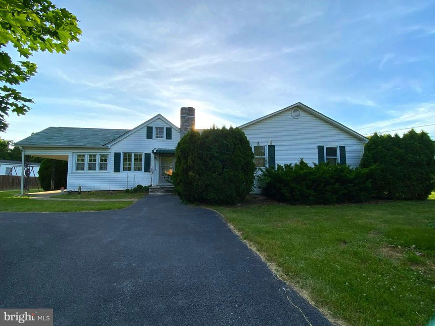 Multiple offers received. Highest and Best by 5 pm 5/30/23. Amazing opportunity to own a piece of the past.  This 3 bedroom 1 bath rancher is a great home for those mid-century lovers or for an investors eye for a remodel.  It has been well cared for by the current owners for the past 60 years. The kitchen has the original wood cabinets and the wonderful retro linoleum flooring.  The L shaped kitchen design lends itself to convenient baking and has room to house a small island.  The kitchen also has room for a small kitchen table.  The dining room area is carpeted and sits by the rear sliding doors overlooking the rear covered porch and built in barbeque grill.  This layout is great for entertaining.  The living room is large enough to cozy up with two couches and a couple of chairs.  As you head down the hallway, you will find 3 bedrooms and the full bath.  The first bedroom is the master bedroom which is incredibly large and has two closets.  The second bedroom is smaller but could be used as a bedroom, office, kids play room or hobby room.  The hall bath is a 3 piece set which includes the original blue toilet, sink and bathtub.  The last bedroom at the end of the hall is a good size and also has double closets. The laundry area is on the lower level and has hanging wall cabinets for storage.  The opposite side of the lower level is a finished section awaiting your creativeness.  
As you step out on the rear porch you will find a place to relax, eat, or a place to entertain by the pool.  The pool area is fenced with a concrete perimeter for your lounging and sunbathing desires.  The 3'-9' gradual sloped vinyl pool will help your hot summer nights drift away.  And what's a pool without a pool shed.  The pool shed holds all of your pool necessities but also has a pool toilet for summer use.  
This property operated as a mini mobile home park for years.  There is room for 5 mobiles at the back of the property.  The current mobile home in the far right of the property is being sold and will be removed prior to settlement unless the new owner would like to purchase it from it's current owner.  The mobile home in the far left corner of the property is owned by the property owner and will convey with the property.  This mobile home is not in great shape and is being convey at no value and in "as is" condition.

This property is worth the look.  With over 1200 sq ft, 3 bedrooms, 1 bathroom and .98 acres...it offers so much to so many. Come see the opportunities in this one.