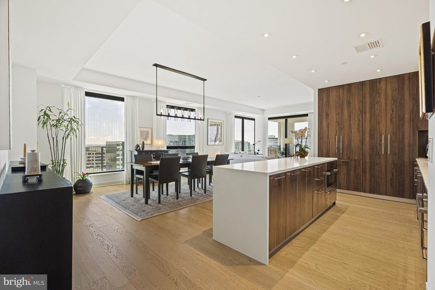 Luxury living at its finest in this exquisite 1,813 sq ft condo with 2 bedrooms, 2.5 baths, and Den area at The Verse, Tysons premier residential building. With 9.5 ft ceilings and floor-to-ceiling windows, natural light floods the open-concept floor plan, creating a spacious and inviting atmosphere. The chef’s kitchen by Cecconi Simone and sizable dining area make both daily living and hosting gatherings a pleasure. Tucked off the large living area, the den offers stunning skyline views and opens to an expansive terrace, which is perfect for urban outdoor living. Retreat to the primary bedroom oasis with a spa-quality bath and custom walk-in closet.  The second bedroom boasts a large en suite bathroom and panoramic views. Upgrades include Restoration Hardware lighting fixtures in the dining area, den and second bedroom as well as motorized shades in the living room, dining room and room darkening in the primary suite. The laundry is in a separate walk-in utility closet in the unit and offers additional storage and shelving. 

Included with the condo are 2 ideally located parking spaces in the secure garage, just steps away for the building’s 7th floor entry.

The Verse offers 24 hour concierge, automated package retrieval, pet spa, state-of-the-art fitness studio, yoga room, guest suite, and massive sky park for entertaining, relaxing, or grilling out! Modern restaurants, unique shops, the Icon Movie Theater as well as the best Whole Foods on the east coast are in the Boro. Close to the Greensboro Metro Stop. The best that Tysons has to offer!