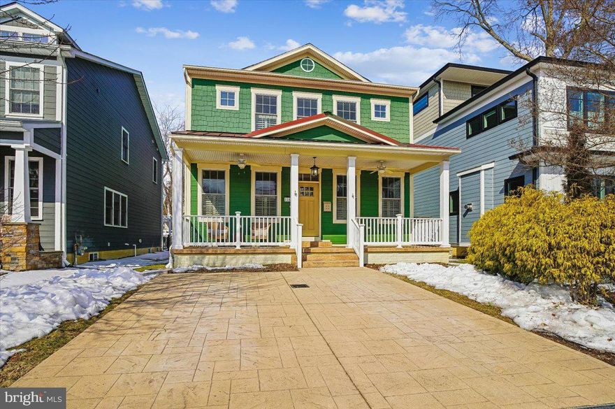 Located in desirable Murray Hill in the heart of downtown Annapolis, this spacious newer-built Colonial-Craftsman home offers the rare combination of modern construction, architectural character, and true walkable in-town living. Built in 2014, the residence begins with a welcoming front porch and opens into a thoughtfully designed main level featuring high ceilings throughout and coffered ceilings accenting the front living and dining rooms — details that create warmth, scale, and presence rarely found in downtown homes.

The open-concept kitchen flows seamlessly into the expansive family room, where a fireplace anchors the space and elevated ceiling heights enhance light and volume. Just beyond, a three-season sunroom sits behind accordion-style glass doors, offering the flexibility to fully integrate with the main living space or remain a separate seasonal retreat. From here, windows and exterior doors open to the rear yard, creating a graceful transition between interior comfort and outdoor living.

A versatile main-level sitting room or study could potentially be a main level bedroom, with attached full bath, and dedicated laundry room providing flexibility for modern lifestyles. The finished lower level adds valuable living space with a wet bar, full bath, generous storage, and walk-out access — ideal for guests, recreation, or media use.

Upstairs, the spacious primary suite features a walk-in closet and a well-appointed bath with separate soaking tub and shower. Three additional bedrooms complete the upper level, including one en suite and two connected by a Jack-and-Jill bath. With over 4,000 square feet of finished living space, the home offers a level of scale and functionality that is far larger than it appears from the street — an exceptional rarity in Murray Hill — along with the added convenience of a two-car off-street parking pad.

Enjoy a short stroll to Amos Garrett Waterside Park, catch a water taxi to City Dock or Eastport, walk to Main Street’s shops and restaurants, or dine under the stars on West Street. This coveted Murray Hill address delivers luxury, space, and lifestyle in one of Annapolis’ most sought-after neighborhood.