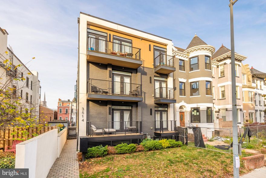 Reserved parking and a private roof deck make this penthouse condo in Columbia Heights a Rare Gem!

Luxurious, modern home with hardwood floors throughout the comfortable, open floor plan and huge picture windows filling the space with natural light. The spacious, eat-in kitchen boasts ample cabinetry in chic white and wood, stainless steel appliances, and matte black hardware.
Each bedroom features a wall of windows and its own spa bath. The primary bedroom includes a walk-in closet with custom shelving.  A washer/dryer in the unit makes laundry convenient.
The stunning, spiral staircase at the heart of the home leads to the roof deck with spectacular city views.
This small, well-maintained building was constructed with high-end materials, including soundproofing. With a walk score of 95, this location is city living at its finest. Head north up 14th for Taqueria Habanero, Mezcalero, Red Derby and Lymans - or just one block to the delectable curries at Thip Khao. Less than 1/2 mile to the Columbia Heights metro, with the amenities of Petworth and Mt. Pleasant in easy reach.