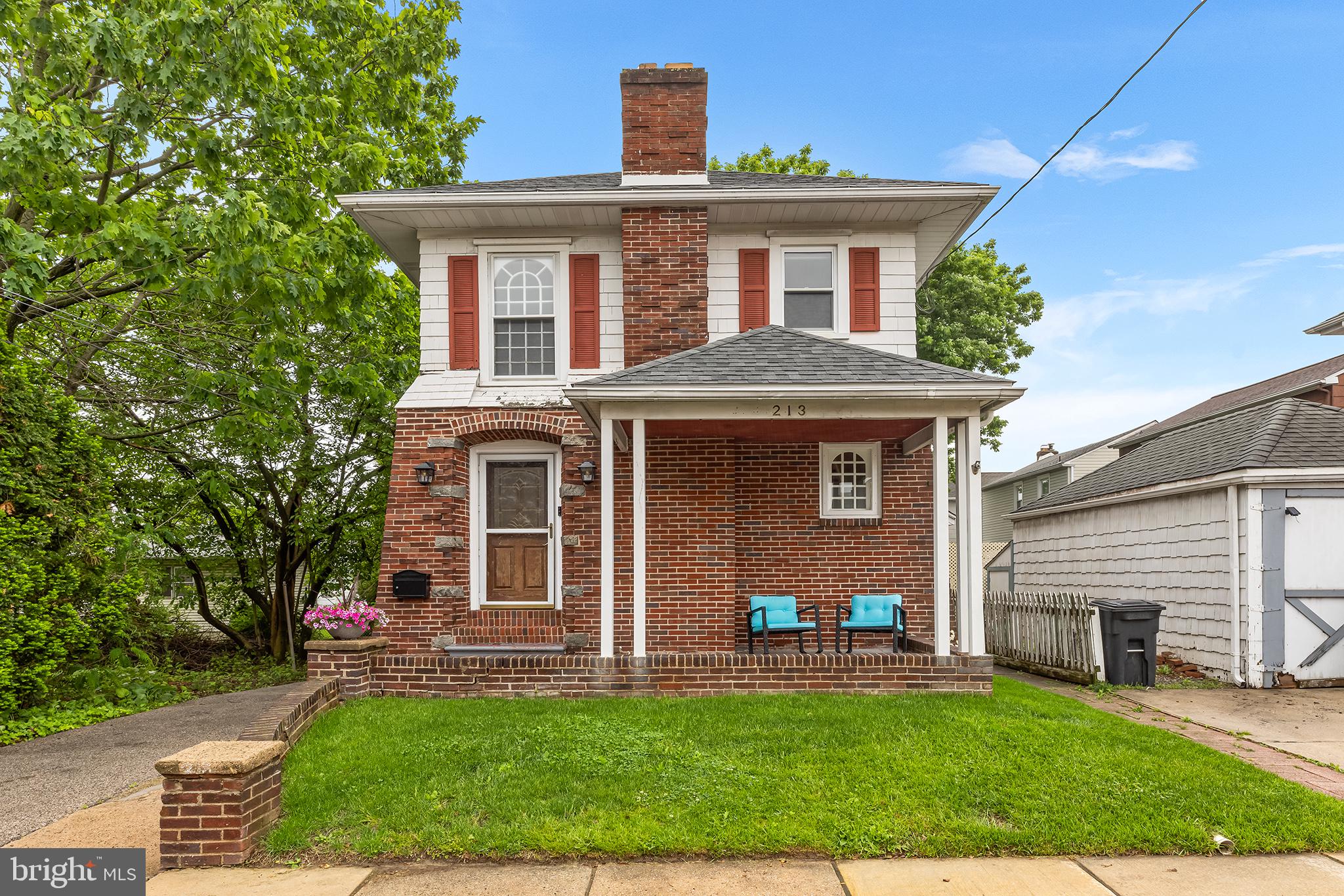 OFFERS DUE MAY 20 4pm
Welcome to 213 Yates Road, a charming and beautifully maintained single-family brick home nestled in the desirable community of Woodlyn, PA. Situated on a private lot with mature landscaping, this property features an oversized detached 2 car garage, a long driveway offering ample parking, and a welcoming front covered porch. Inside, wood floors flow throughout sun-filled living spaces, including a comfortable living room with a fireplace and a bright dining room that leads to a galley-style kitchen with generous counter space. A convenient side entry opens to both the kitchen and the basement—perfect for muddy shoes. Ther basement includes an a half bath awaiting your personal touch. Upstairs, you'll find three bedrooms and a full hall bath with tall ceilings and exposed wood beams. The main bedroom is quite large with plenty of closet space and access to the very well insulated attic. Step outside to a peaceful backyard oasis, ideal for relaxing or entertaining. The detached garage is a standout feature, perfect for car enthusiasts, extra storage, work bench and tools, or all your outdoor gear. Located in the Ridley School District and just minutes from major highways, shopping, and public transportation, this move-in-ready gem offers the perfect blend of comfort, functionality, and location—don’t miss your chance to make it yours!