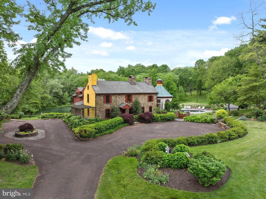 Welcome to Sugartown Springs Farm- a magnificent estate consisting of two adjoining parcels that come together to create a one-of-a-kind sanctuary in the middle of Radnor Hunt and Willistown Township. Sitting on 22.8 acres of pristine, scenic land, this incredible property offers a picturesque Chester County style farm house that has been lovingly updated and expanded throughout the years and a stunning two story barn that offers space for every occasion.
Combining old world charm with the luxuries of today, this 4-bedroom, 4.5-bathroom home offers architectural details such as exposed beams, stone walls, 7 fireplaces plus the original hearth, hardwood flooring throughout, and deep window sills. Updates include a gourmet kitchen with island seating, stainless steel appliances and attached dining area with adjoining pantry/mudroom; a massive family room with fireplace and French doors to the patio; formal study with fireplace and built-ins; sitting room with hearth and bar area; and two story solarium offering incredible views 12 months a year. The second floor offers a loft space which doubles as a library; a primary bedroom with French doors to view the grounds, a private fireplace, and an ensuite bathroom with soaking tub, shower, and double vanities; an ensuite bedroom with its own fireplace and adjoining bathroom; and this floor is completed with a third ensuite bedroom/bathroom. The lower, walk-out level is completely finished and offers additional living space and could easily be considered an in-law-suite with a full bathroom, an additional bedroom, exterior doors to the grounds, and a small wet bar area. Exiting the main house you are greeted by a picturesque pond and flagstone surround pool- both kept private by the tree barrier that runs along the entire property. The circular driveway along with the 6 car detached garage offers tons of room for all your guests to visit. 
The two-story barn completes this property and could function as a house of it’s own offering two stories of magnificent space. The top level is open and grand and is perfect to host events or use as a work from home office. The first floor offers a bedroom, full bathroom, kitchenette, and bonus space to be used as desired. The courtyard outside of the barn offers incredible views of the property and is the perfect place to relax at the end of the day! All of this while being within top rated Great Valley School District; close to all major roadways for an easy commute to Philadelphia and NYC; minutes to Malvern Borough and downtown Wayne and central to some of the best private schools in the country- Episcopal Academy, Malvern Prep, and The Phelps School. This property truly has it all and is like no other; make your appointment today- you will not be disappointed!