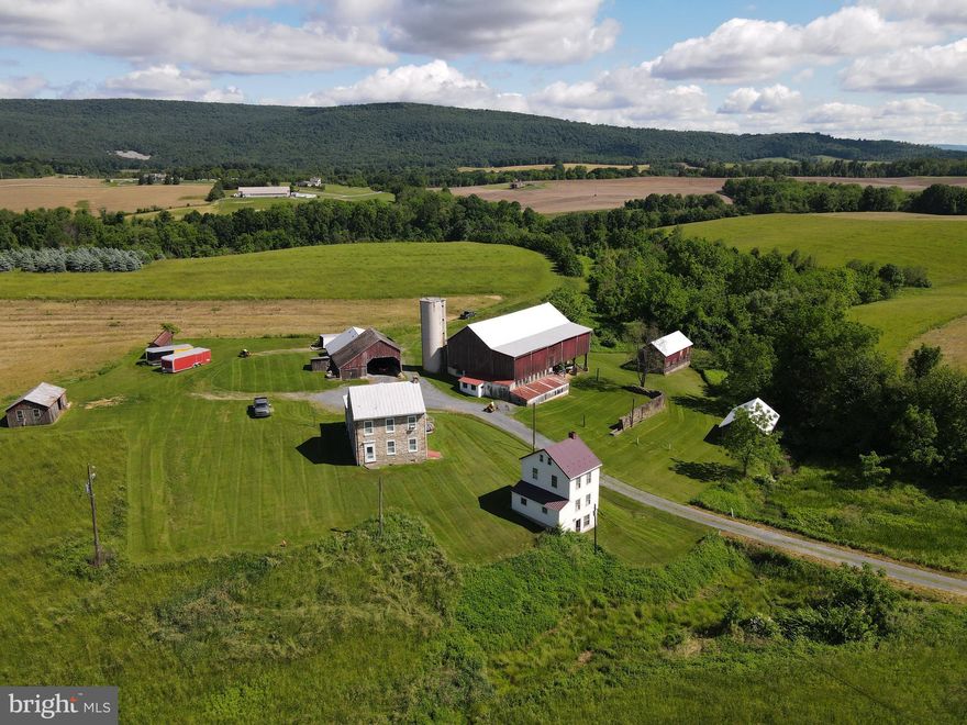 This 110-acre farm presents a rare opportunity to acquire productive agricultural land with long-term potential. Approximately 88 acres are tillable, and the entire property is currently leased for agricultural use. With over 3,600 feet of road frontage and a prime location just one mile from the I-78 and Route 143 interchange, the property offers excellent access in a peaceful rural setting. Enjoy magnificent views of the Blue Mountain—an ideal backdrop for a potential winery, horse farm, or agri-tourism venture. Two approved residential building lots are included, offering added flexibility for future use or investment. Additionally, 76 acres are zoned for Commercial District use, creating further opportunities for development or business expansion. Whether you're looking to expand your land holdings or invest in a scenic, income-producing property with vision, this land stands out. Be sure to view aerial tour.