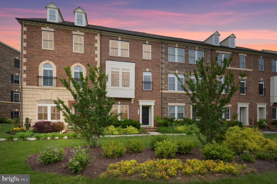 This spectacular NV Villages of Urbana townhome is situated in a prime location! Step out the rear door for access to the neighborhood playground or walk one block to the Urbana Community Park! Walk two blocks in the other direction to go to the Urbana Regional Park. Plus, the Urbana Market District--with its library, grocery store and restaurants is just around the corner! This home  offers the ultimate in relaxing spaces with  both a balcony and a rooftop deck! Perfect for enjoying your morning coffee or for entertaining! With new neutral carpet and refinished hardwood on the main level, this four level home is move-in ready! The light-filled walk-in level is light-filled and perfect for a second family room, home office or virtual learning area. This level also features a storage area and half bath. The open concept main level features plenty of living space and a fantastic chef's kitchen and eating area! You'll love cooking and entertaining in the gourmet kitchen with the expansive granite island, breakfast bar, upgraded granite counters and cabinets and stainless steel appliances! Extend your living space onto the main level balcony! On the next level, the expansive Owner's Suite features a beautiful spa-like bathroom with a huge custom-tiled shower. Enjoy the convenience of two walk-in closets and the upper level laundry. All this, plus two more large bedrooms and an additional hall bathroom. The fourth level features an additional bedroom, huge walk-in closet, full bathroom, and rooftop terrace! This level features the utmost in privacy! All this, plus an attached two car garage. Close to all the amenities that the Villages of Urbana has to offer--including Blue Ribbon schools. The HOA offers activities, tennis and basketball courts, walking trails and  two Villages of Urbana pools, including the new resort-style pool with a lazy river and the clubhouse with a work-out room. This home offers the utmost in luxury and convenience.