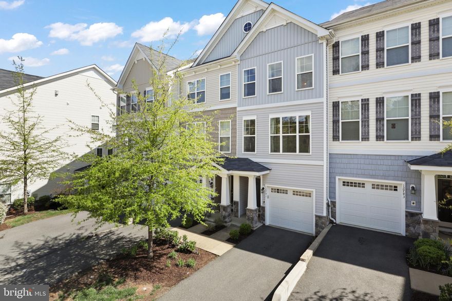 Welcome to 12741 Lotte Dr — a beautifully maintained 3-level townhome in the heart of Woodbridge, built in 2017 and just a short walk to historic Occoquan! This home offers 3 spacious bedrooms and 3.5 bathrooms, including a private entry-level suite with a full bath and access to a peaceful patio that backs to trees. The main level features an open floor plan filled with natural light, a cozy fireplace, and a seamless flow to the dining area and kitchen. Enjoy a second outdoor space with a spacious deck, perfect for relaxing or entertaining. Upstairs, you'll find two large bedrooms each with their own en-suite bath, including a primary suite with a sleek, modern bathroom. Low $257/month condo fee includes exterior maintenance and more. Fantastic location near shops, dining, commuter routes, and the scenic Occoquan waterfront!