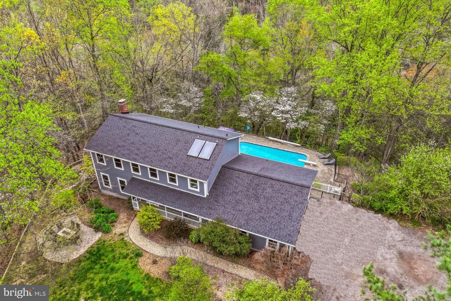 Welcome to 658 Echo Cove Dr, a peaceful, secluded
homestead on 3.73 acres. This tranquil wooded property backs up to protected public land
and the serene Indian Creek Branch as it flows to the Severn River. Towering oaks invite
you down the driveway into the convenient two-car attached garage with access to the first
floor, basement, and an expansive multi-level rear deck. A quaint stone pathway leads you
past the magnolia-shaded patio through the front door into an airy foyer. From there, enjoy
sunny afternoons in the south-facing FR or cozy evenings in the spacious living room
efficiently heated with a built in pellet stove. French doors sweep from the living room onto
a large upper deck, overlooking the in-ground pool and a panoramic view of the forest.
Nestled between wild cherries and flowering dogwood trees, wildlife including bald eagles,
barred owls, and pileated woodpeckers are frequently seen. Heading upstairs, you’ll find a
roomy primary bedroom with en-suite bathroom and more views of the wooded acres, as
well as a shared hall bathroom. Four more ample bedrooms, including one with its own
water closet, are complemented by an upstairs laundry closet with washer and dryer.
Additional laundry hookups are found in the first floor bathroom. The basement includes a
large recreation room, walk-in storage room, upgraded water softener, and an efficient solar
hot water system. Additional features of this one-of-a-kind homestead includes the
detached building with a studio style apartment, third garage, perfect for a workshop, a
large office space with a water closet and kitchenette. Three massive windows allow natural
light into your at-home office while internet wired for LAN with five stations makes this the
perfect spot for your work-from-home needs. Upstairs, the studio apartment with a separate
entrance, kitchenette, full bath, and private deck provides more opportunities to soak in the
tranquility of this unique location. The Arden on the Severn community includes four
beaches with pavilions and boat ramps on the Severn River for you and your friends to
enjoy. All these features come within easy reach of Annapolis, Fort Meade, Baltimore, and
DC. Contact today to schedule your private showing!