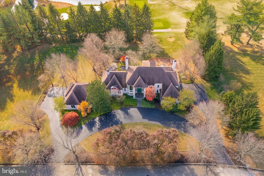 Fabulous, custom contemporary home overlooking the third and sixth fairways of Sunnybrook Golf Club. There are multiple rooms for everyone. Do you have a need for an in-law or nanny suite? If the answer is yes, then this is the one for you. There is a full suite of rooms on the lower level. Do you like to entertain? This home is an entertainer’s dream with a three-tier deck overlooking the golf course. Do you like to collect and drink wine? This home has a beautiful wine cellar. Are you a car enthusiast? This home has a six-car garage and one of the bays has a car lift. If you are looking for a primary suite on the first floor, this home has his and hers full baths and a den with a fireplace. If you are looking for a home to grow into, this is the home, with spacious bedrooms and multiple full baths at the ready. If you are looking for an open concept setting, this home has a full eat in kitchen open to the family room with wood burning fireplace overlooking the golf course.  Do you like outdoor space to play games and enjoy the great outdoors? This home is on 1.65 acres, with plenty of room for games, enjoying the man-made pond and practicing sports. Enter this home from the semicircular driveway, up the stairs to the grand entrance and open foyer. Step down to the beautiful sunken living room with views to the backyard with pond and a stone, woodburning fireplace. On the right is a formal dining room with an elegant chandelier. Flowing on, there is a large eat-in kitchen with views of the golf course, Corian counters and open concept to the family room with another handsome, wood burning fireplace. Off the family room is an attractive three tier Trex deck. This would be an amazing place to host parties, enjoy a peaceful cup of coffee while overlooking the golf course or just enjoying life. There is also a powder room and exit to one of the two, three car garages. On the other side of the first floor is a laundry room, conveniently located near the primary suite with a sitting room with a marble surrounded fireplace. There are also his and hers primary full baths and walk-in closets. Climb the open staircase to the second floor, looking out onto the front of the property through an expansive window. Upstairs you will walk a wide-open hallway leading to the bedrooms. There are three very spacious bedrooms. Two of the bedrooms share a full bath and the third bedroom has its own full bath. Plenty of closet space and open attic space for storage. The lower level, which is ground level, has a huge open sound proof room, perfect for gameday gatherings. This room leads to the in-law/nanny suite or a perfect home office. There is a full bath, wine cellar and cedar closet and an unfinished area for storage. Did I say this home has everything? Located on a small cul de sac off of Stenton Avenue in Whitemarsh Township, you are centrally positioned for easy access to the many shops, restaurants, golf courses, walking trails, route 476, Colonial school district and many private and parochial schools that this area has to offer. Come see how you can make this home into your own oasis.