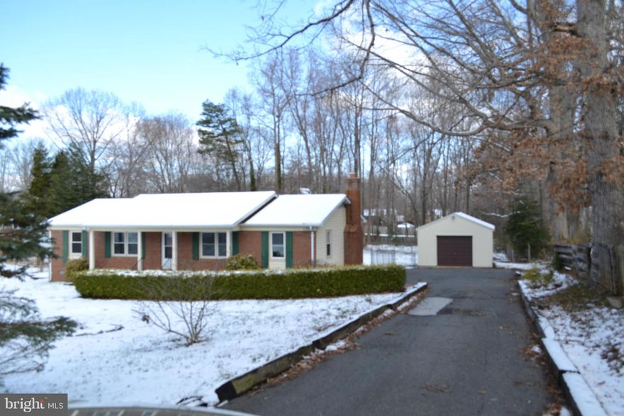 Location, location, location! Less than 2 miles to shopping and I95 and mere minutes to Rt. 1, Quantico, and commuter lot. The tranquil setting will make you think you are a world away! So much of the interior of this beautiful brick home has been renovated and updated: floors, bathrooms, carpet, and stainless steel appliances. Fenced backyard, deck, detached garage, and shed also convey!