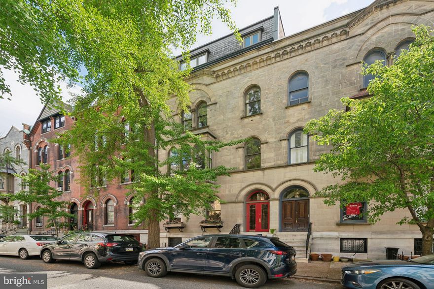 Magnificent high-Victorian Rittenhouse Manse with expansive 25’ frontage, 4 stories plus walk out lower level to a lush rear garden. This Venetian Gothic townhouse features a marble & limestone facade with arching windows and oriel bay overlooking St James street, one of the neighborhood's iconic blocks, lined with immaculately preserved homes by Furness & other notable 19th c. architects.  A previous rooming house until the current owners totally restored it to single family use with noted architect & former AIA President, Susan Maxman. 10 bedrooms, 4 1/2 baths, 6 fireplaces, and over 5000 sf of living space this gracious home accommodates family & guests alike plus offers many additional uses; home office, painting studio, sitting room etc.  11’ high ceilings throughout are crowned by original plaster mouldings and architectonic details abound from intricately carved mantles to a central wraparound staircase surmounted with skylight, illuminating the center of the home.  Enter the home through double doors flanking a walnut paneled vestibule, a weather break from the elements. The main level offers formal living room with decorative, carved marble fireplace, white oak herringbone floors and gallery lighting to highlight your art collection. The dining room connects from both the main hall or through a passage under the stair and is the ideal space for sumptuous dinner parties or intimate family gatherings.  High ceilings, an original carved wood fireplace mantle and a deep bay window overlook the garden.  The home’s "NY Loft" kitchen is a study in modern style and restraint, part of a second renovation by architect Spence Kass.  Warm rift-cut mahogany cabinetry contrasts with cool gray quartz counters and frosted glass backsplash.  Sleek, stainless Sub-zero and Miele appliances complete the state of the art chef’s kitchen. At the end of the main level an intimate breakfast room with original leaded glass window hovers over the garden, and a set of steps leads down to the back yard sanctuary. Ascend the central wraparound staircase to the primary bedroom level where a 25’ wide room accommodates any size bed, built-in closets, a sitting area in the oriel and a statement-making, turned and carved, decorative wood mantel.  Walk-through closets join the bedroom to a private sitting room which connects to the spa-like primary bath, making this floor your private suite of rooms. The bathroom offers separate soaking tub & shower, water closet and pedestal sink.  The 3rd floor has a group of 4 bedrooms and 2 baths, both rendered in original porcelain subway tiles, one features a vintage soaking tub. Two of the bedrooms serve alternative purposes, one, a sitting room and the other has been transformed into a deluxe laundry space. The home’s top floor has 4 more bedrooms and newly renovated hall bath with glass enclosed shower.  The largest of the bedrooms is used as a home office, tucked into the south facing bay window. A mixture of original red pine and golden oak hardwoods cover the home’s upper floors. The lower level, originally the home’s kitchen, has direct access to both the rear garden & the street in front under the stairs (perfect for bringing bikes in from outside). Currently used as an artist’s studio, this level also makes an excellent den, playroom or workout space.   Located in the award-winning Greenfield School catchment and equidistant to Rittenhouse & Fitler Squares and the miles-long Schuylkill Banks river trail, this home rests in the middle of a low-traffic, tree-lined street.  Sellers will pay for a year’s parking at a nearby garage, steps from the house. Near incredible shopping on Walnut & Chestnut Streets and some of the city’s best restaurants, Vernick, Parc, Wilder and so many more. With easy access to 30th St station, Penn, Drexel, CHOP, HUP and the downtown business core - this outstanding home offers everything that makes urban living so incredible.  See this stunning home today!