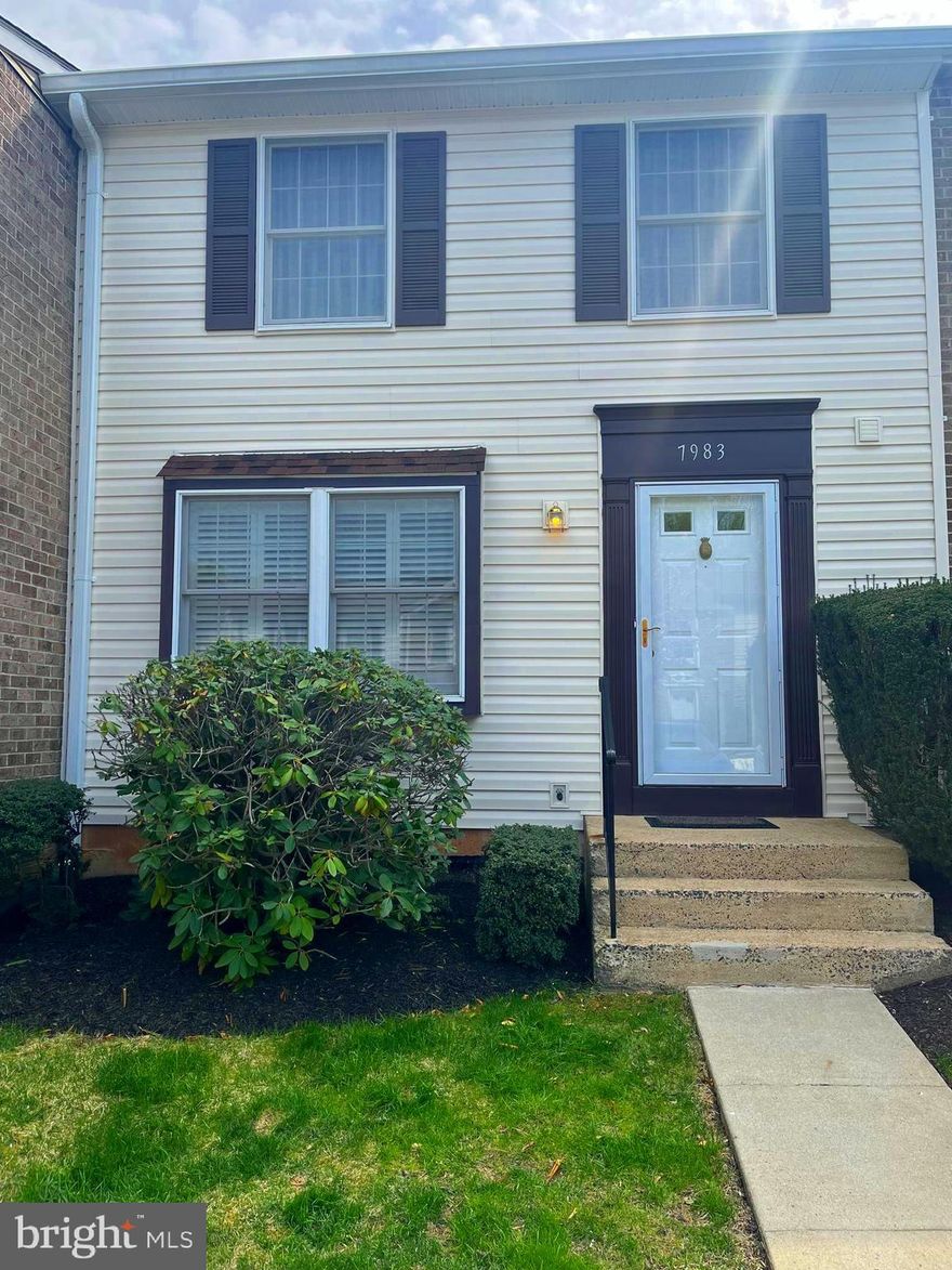 White kitchen cabinets, granite counters, stainless steel appliances.  Walk out lower level to patio.