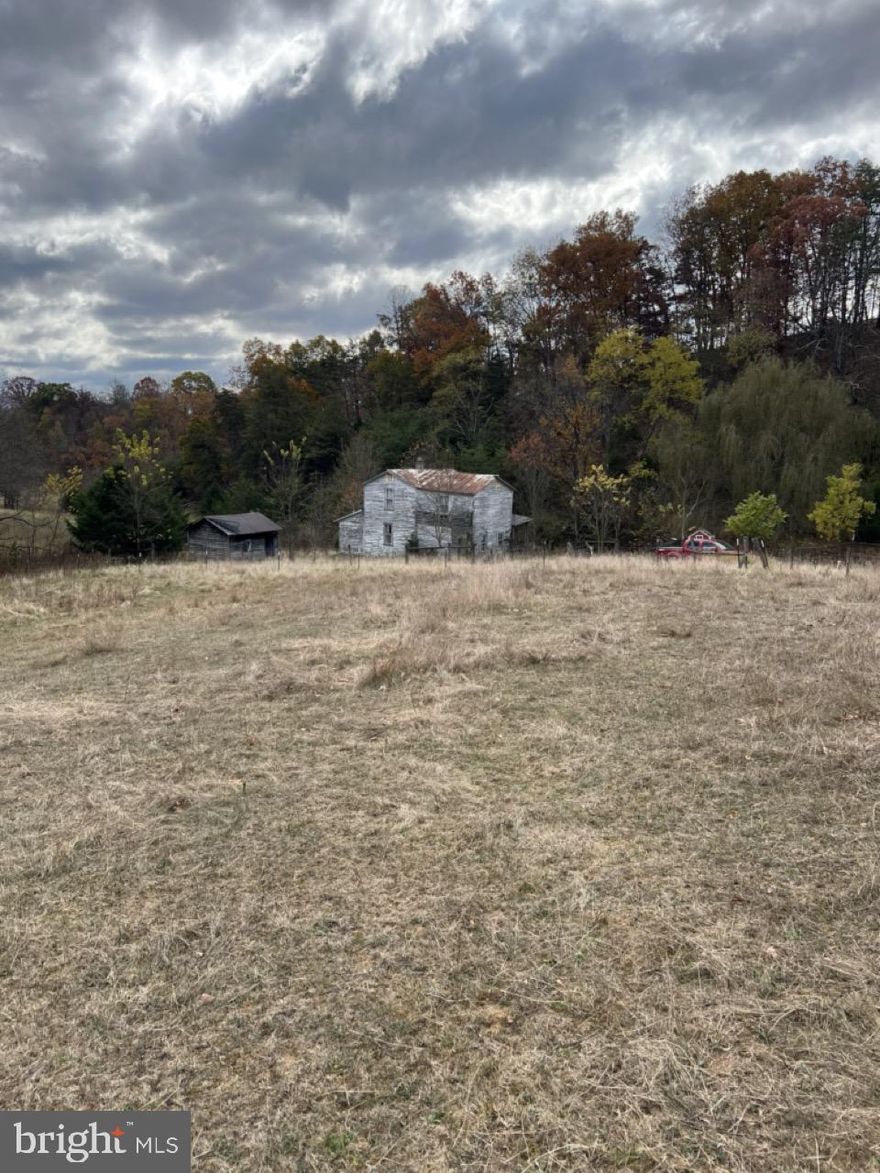 ✨ Escape to Your Own Private Mountain Retreat in Fisher, WV ✨
Tucked away in a peaceful valley, this 13.82-acre mountain paradise offers the perfect blend of seclusion, scenery, and potential. Whether you’re dreaming of an off-grid lifestyle, a vacation getaway, or a long-term investment, this property is your blank canvas for mountain living.
Enjoy sweeping country views, year-round running water, and total privacy on your land, featuring approximately 750 feet of year-round flowing stream frontage. About half of the acreage is open and fenced pasture—ideal for hobby farming, horses, or gardens—while the rest offers mature woods, gentle terrain, and multiple potential homesites.
The rustic farmhouse and several outbuildings are ready for your vision. The home is perfect for off-grid camping or a custom renovation project, and an existing septic system (functional, details unknown) gives you a head start for future development. With room for RV or camper hookups, you can enjoy the property right away while you build or restore.
Deeded access to the nearby adjoining spring house and storage tanks for abundant fresh spring water.
This property is being sold as-is; kitchen is gutted, no active electric or  water (both available nearby), and the existing toilet currently operates manually.
If you’ve been searching for a West Virginia mountain escape—a place to recharge, create, and build your dream homestead or vacation retreat—this is it.
🌄 Don’t miss this rare opportunity to own your own slice of Almost Heaven.
📞 Schedule your private tour today and experience the peace, privacy, and potential of this mountain gem.