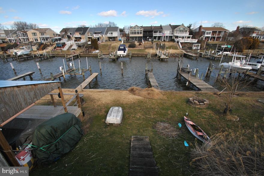 MULTIPLE OFFERS RECEIVED ALL HIGHEST AND BEST OFFERS ARE DUE BY WED 2/8/23 AT 8PM! PRICED BELOW MARKET FOR QUICK SALE! THIS SPACIOUS 2 BEDROOM 1.5 BATH WATERFRONT TOWNHOUSE IS READY FOR YOU TO MOVE RIGHT IN AND ENJOY SUMMER LIVING ON RUMSEY ISLAND! THIS HOME FEATURES: EXTRA LARGE DRIVEWAY, EAT IN KITCHEN WITH STAINLESS STEEL APPLIANCES, SPACIOUS LIVING ROOM/DINING ROOM COMBINATION AND FAMILY ROOM WITH SLIDER TO YOUR REAR OASIS WITH MAINTENANCE FREE DECK SITTING AREA AND STEPS LEADING TO YOUR PRIVATE PIER WITH BOATSLIP, EXTRA LARGE OWNERS SUITE WITH 2 CLOSETS, SITTING ROOM WITH FRENCH DOOR LEADING TO YOUR REAR UPPER LEVEL DECK OVERLOOKING THE WATER, RECENTLY UPDATED BATHROOM & TOO MUCH MORE TO LIST HERE!  THIS IS AN ESTATE SALE BEING SOLD AS IS - SELLER WILL NOT MAKE ANY REPAIRS!